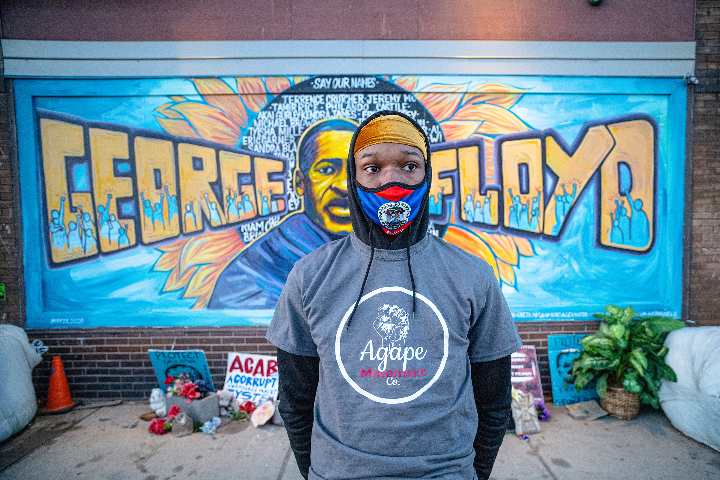 Ijahvonn Waller, 16, stands in front of a mural of Floyd painted on a wall of Cup Foods, near where Floyd died. Waller was preparing to join the members of Agape. (Ruddy Roye for TIME)