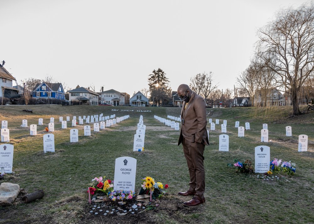 George Floyd's brother, Philonise Floyd, visits a protest art installation on April 1. The tombstones bear the names of Black Americans who were lynched by private citizens, fatally shot or choked by police officers, and other victims who died in police custody.