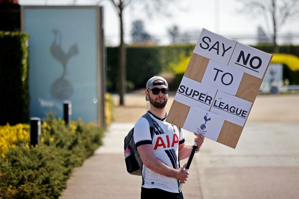 A Tottenham Hotspur's fan holds an anti-European Super League placard has he demonstrates outside the English Premier League football club's training ground in north London on April 19, 2021. (Tolga Akmen—AFP via Getty Images)