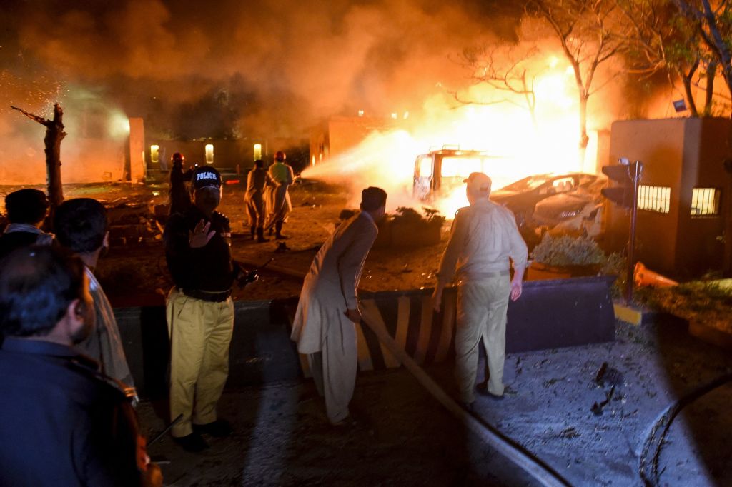 Security personnel and fire fighters arrive at the site of an explosion in Quetta on April 21, 2021. (BANARAS KHAN/AFP via Getty Images)