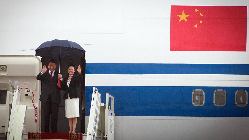 Chinese president Xi Jinping (L) and his wife Peng Liyuan disembark from their aircraft upon arriving in Ulan Bator, Mogolia on August 21, 2014. (Byambasuren Byamba-Ochir/AFP via Getty Images)