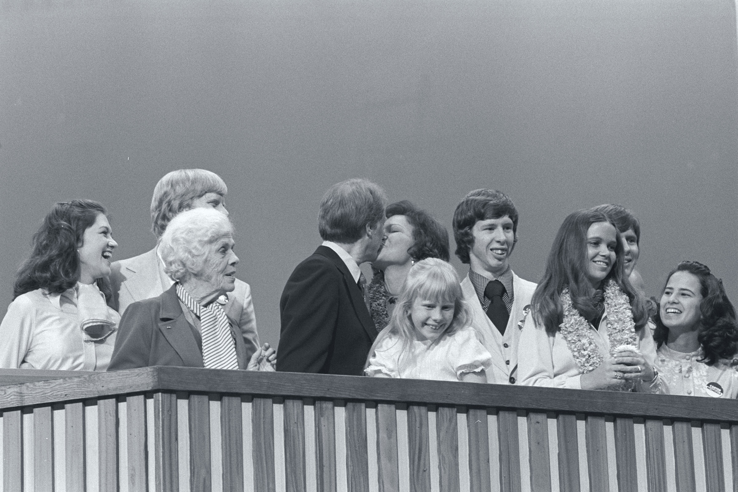 Then presidential nominee Jimmy Carter and Rosalynn Carter share a kiss while standing with their family at the 1976 Democratic National Convention. (Owen Franken—Corbis/Getty Images)