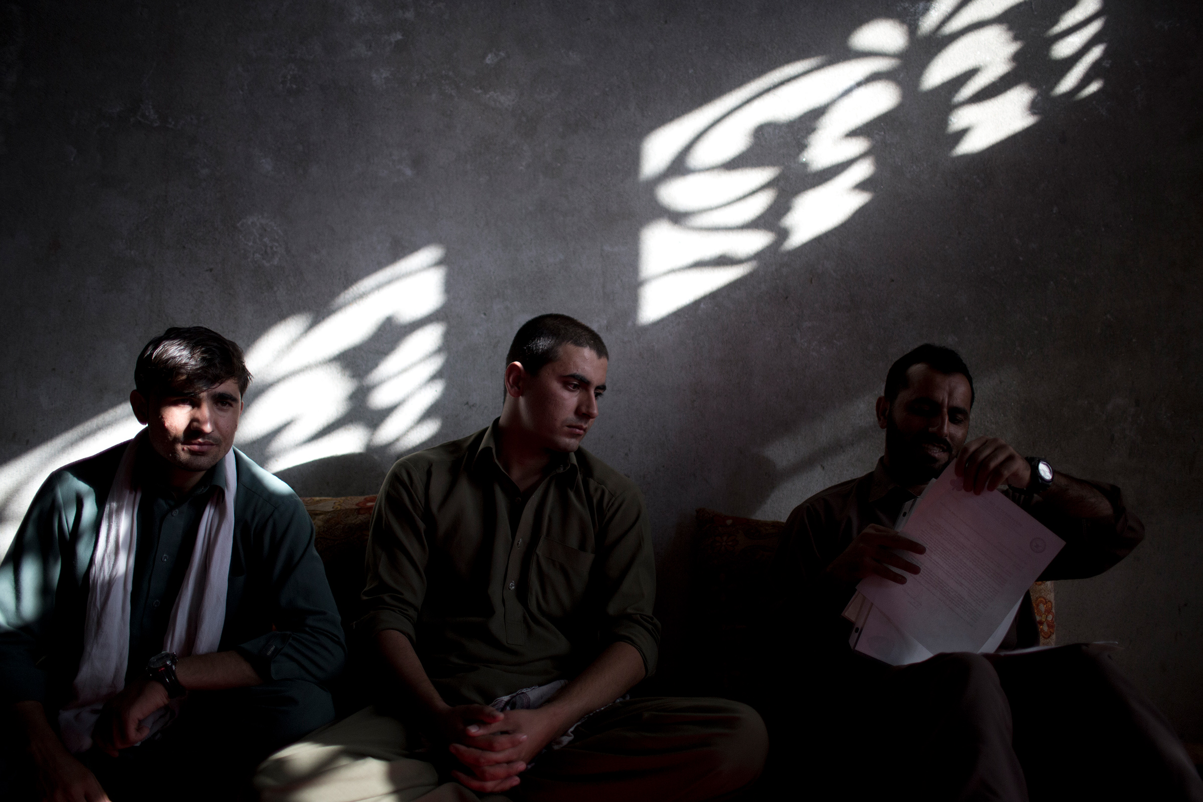 Interpreters, from left, Afiqullah, Irshadullah and Said Hussein, all working for the U.S. army, meet in Jalalabad, Afghanistan, on Oct. 20, 2012. They applied for a U.S. visa through the Afghan SIV program.