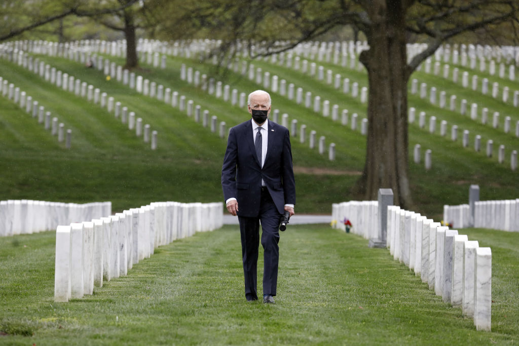 President Joe Biden visits Section 60 of Arlington National Cemetery on April 14, 2021. That day, Biden announced his decision to fully withdraw U.S. forces from Afghanistan by the 20th anniversary of the Sept. 11, 2001, attacks. (Yuri Gripas—Abaca/Bloomberg/Getty Images)