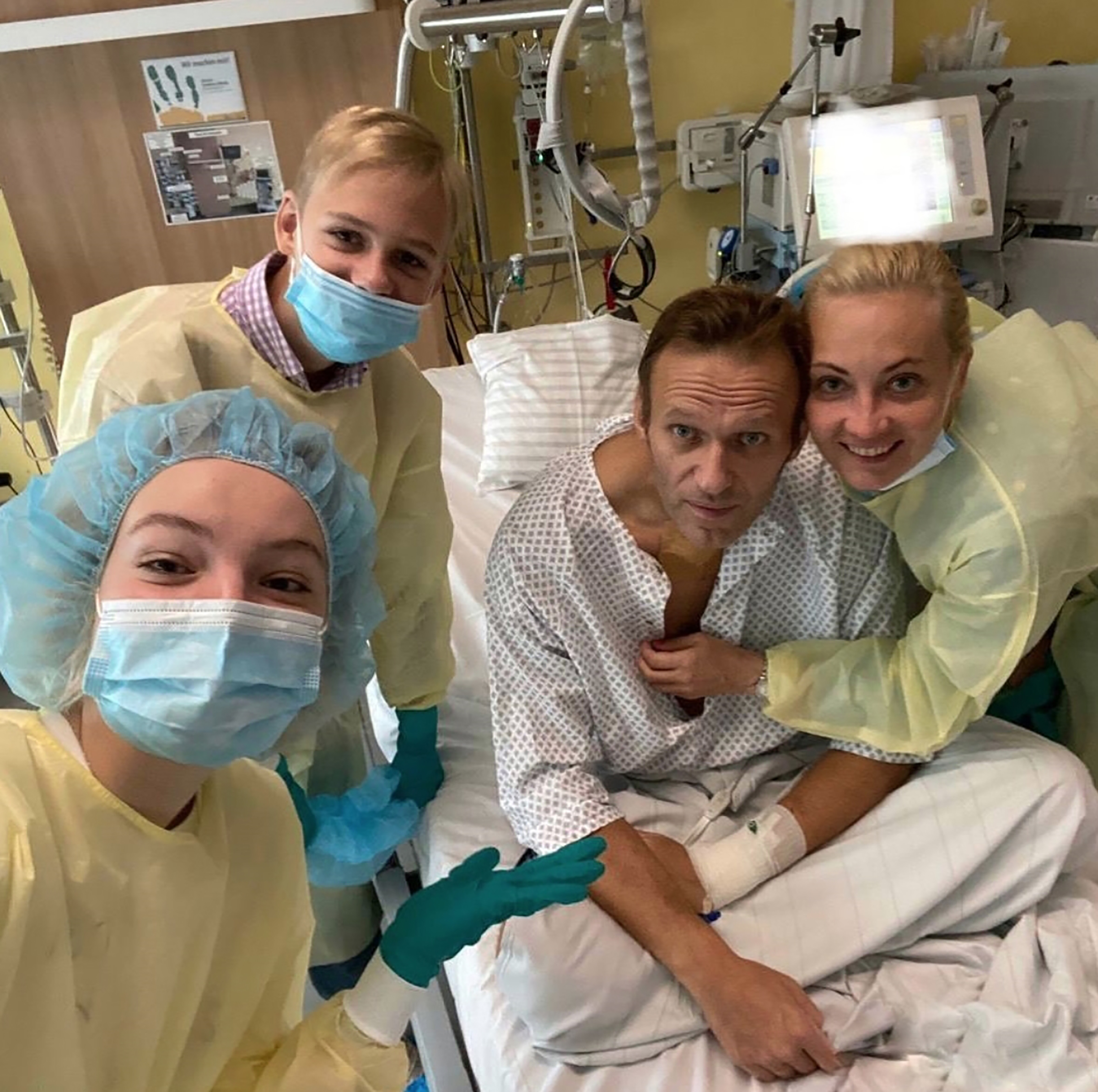 An image shared on the Instagram account of Alexei Navalny shows the Russian opposition leader on a hospital bed surrounded by his wife and two children as his treatment continues in Berlin on Sept. 15, 2020.