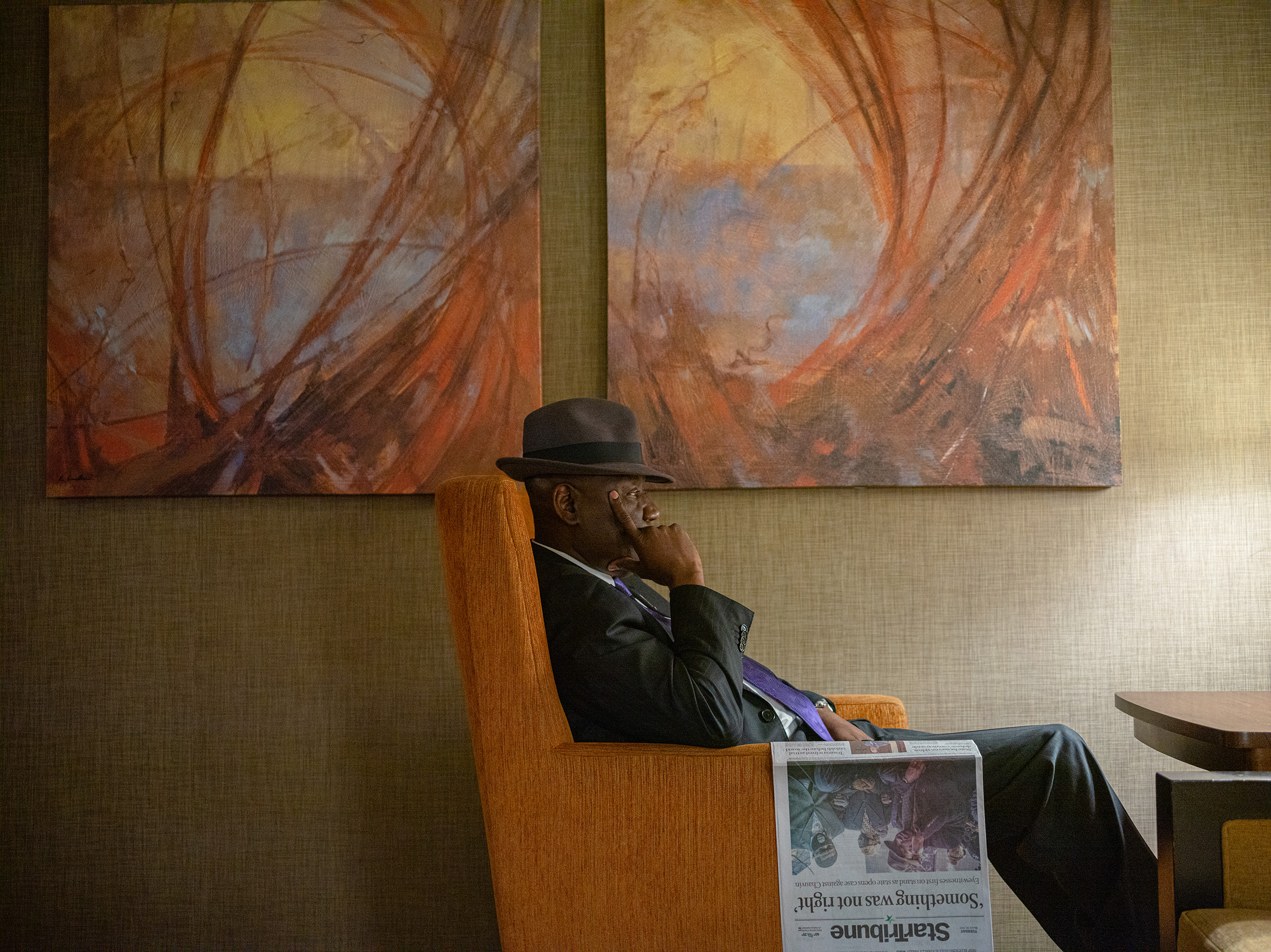 Crump rests after reading the paper in the lobby of the Westin Hotel in Minneapolis on March 30.