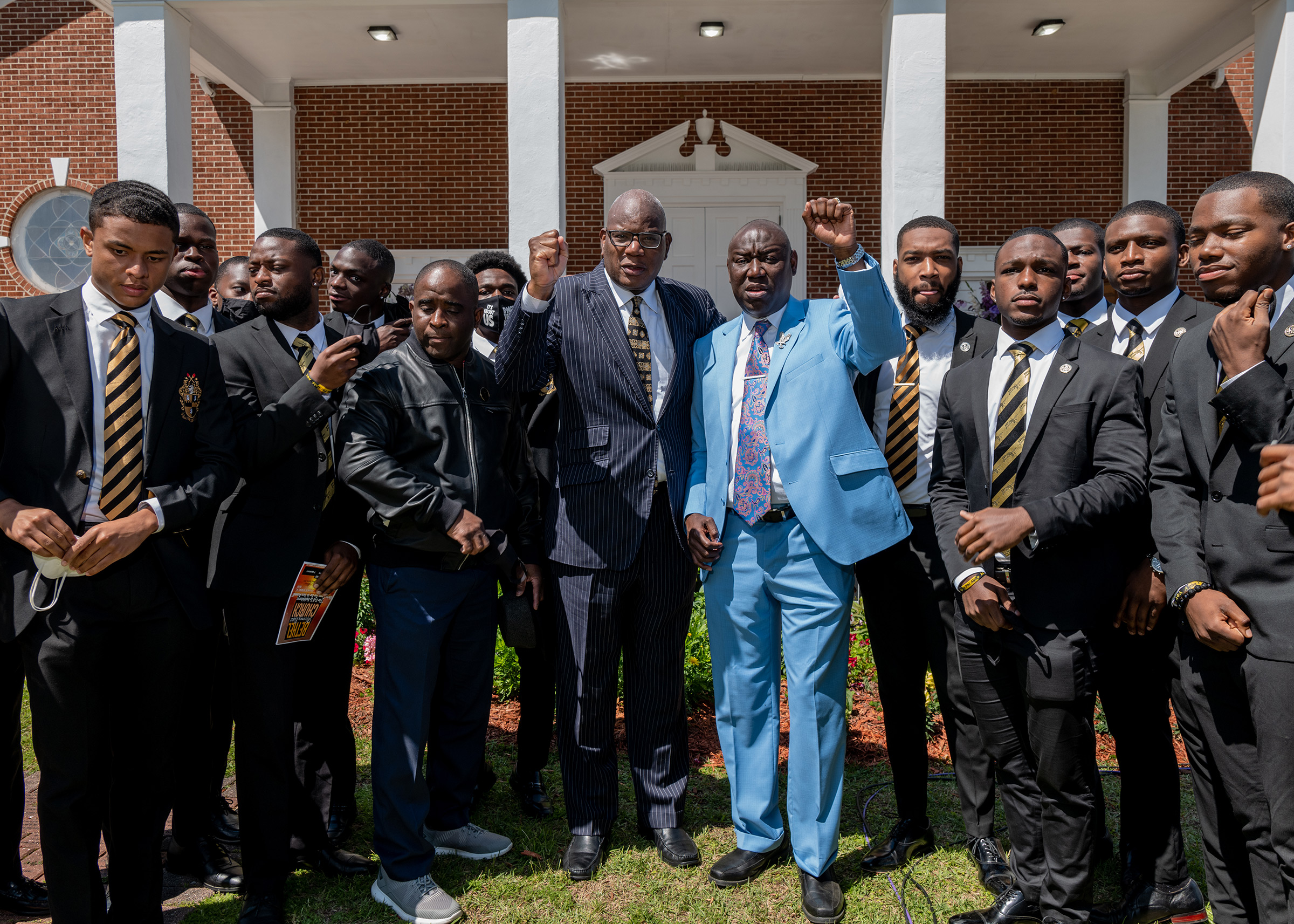 Crump poses for a photo with pastor Holmes of the Bethel Missionary Baptist Church and members of Alpha Phi Alpha after Easter Sunday Mass at in Tallahassee, Fla., on April 4.
