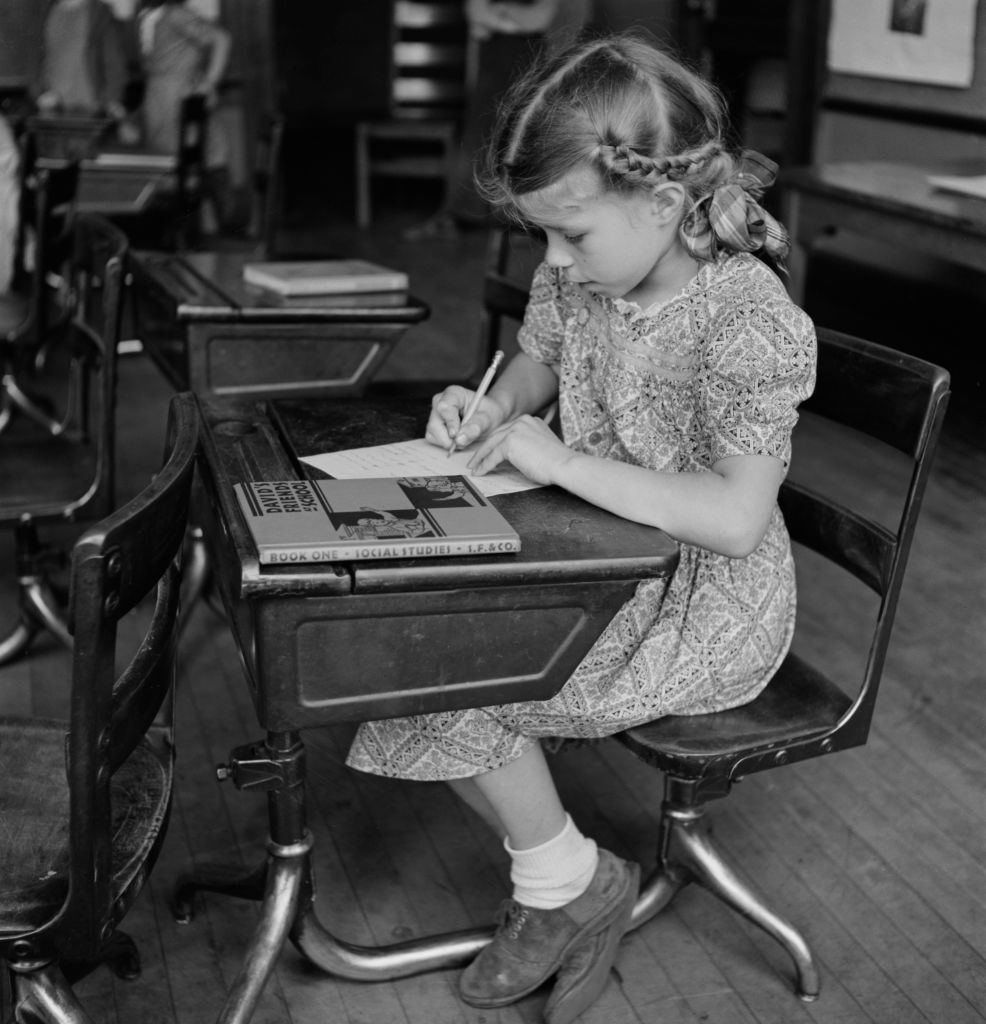 A girl in class with her social studies book. Southington, Conn., May 1942. (Fenno Jacobs for Office of War Information—Universal Images Group / Getty)