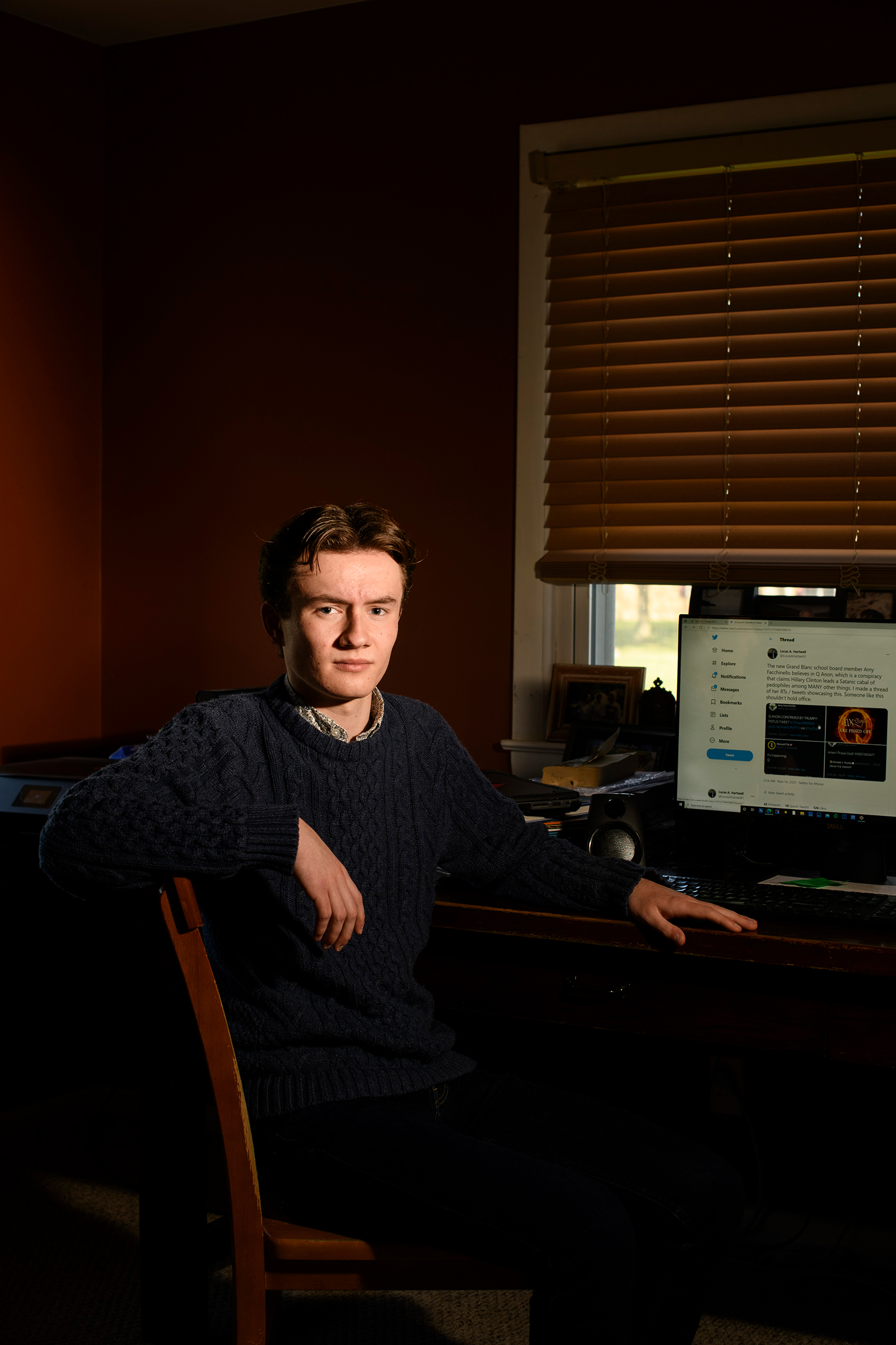 Lucas Hartwell, a senior at Grand Blanc Community High School, in the room he uses as his work space in Grand Blanc, Mich.