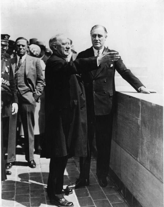 The Empire State Building was formally opened in a ceremony in which President Hoover, Alfred E. Smith, President of the Empire State Corporation, Governor Roosevelt, and other notables participated. This photo shows Ex-Governor Smith pointing out the sights of the city to Governor Roosevelt from 1 of 2 observation floors on May 1, 1931.