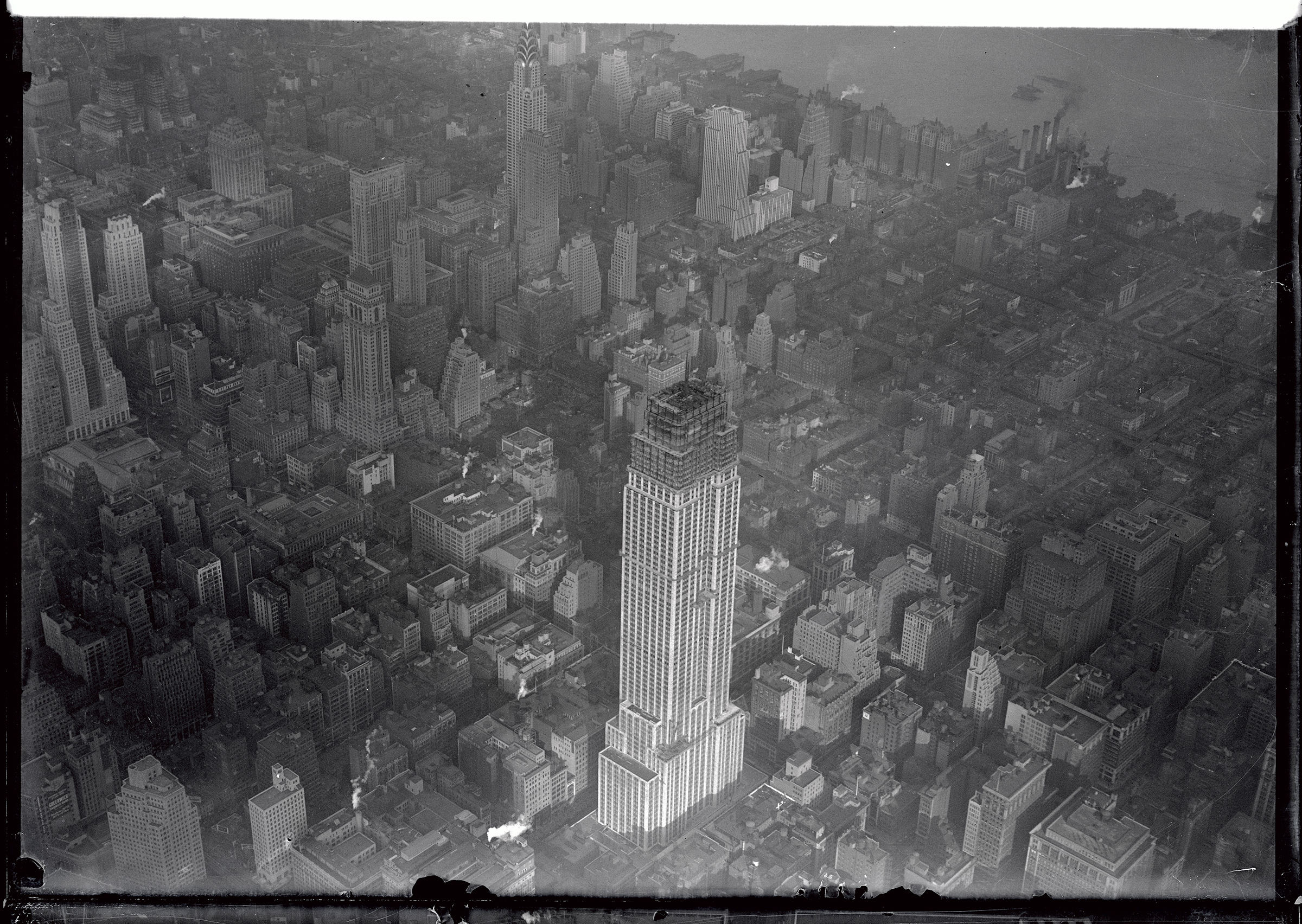 An aerial photograph of The Empire State Building from October 1930. There are 88 stories finished, and when completion, will reach 102 stories.