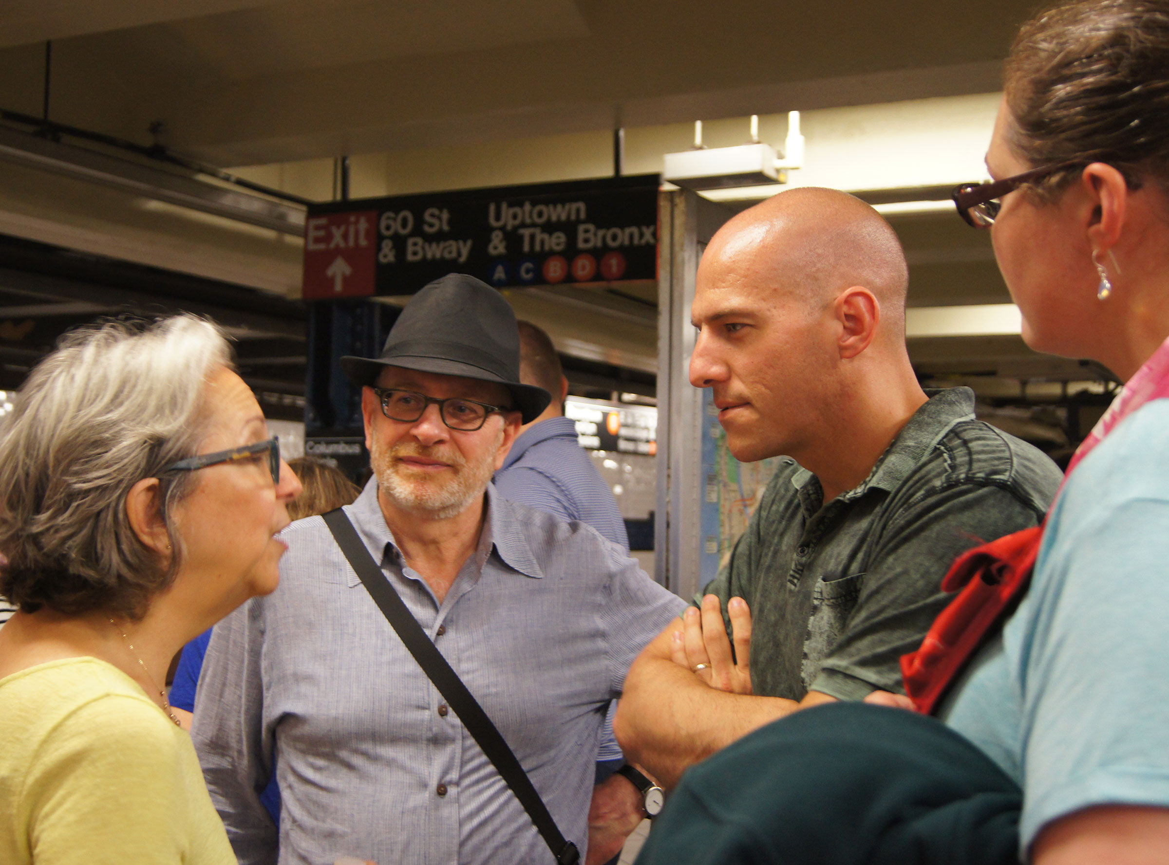 Rabbi Matalon (in hat) with Caleb Follett and other members of the exchange, at a subway stop in New York City. (Amanda Ripley)