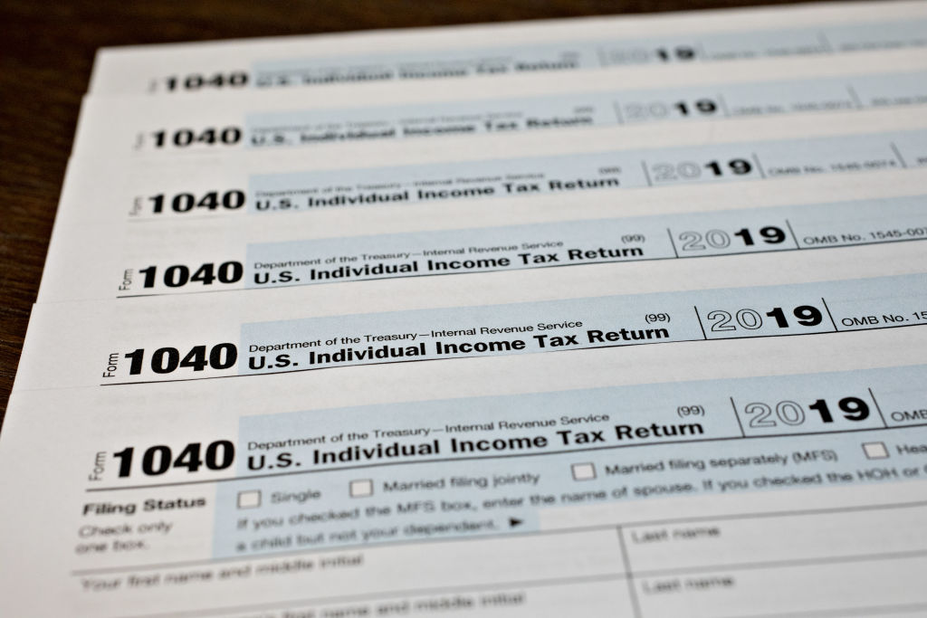 A U.S. Department of the Treasury Internal Revenue Service (IRS) 1040 Individual Income Tax form for the 2019 tax year is arranged for a photograph in Tiskilwa, Illinois, U.S., on Friday, March 20, 2020. Tax forms and payments wont be due to the Internal Revenue Service until July 15 this year, Treasury Secretary Steven Mnuchin said in a tweet, as the government looks for ways to respond to the coronavirus. (Daniel Acker/Bloomberg via Getty Images)