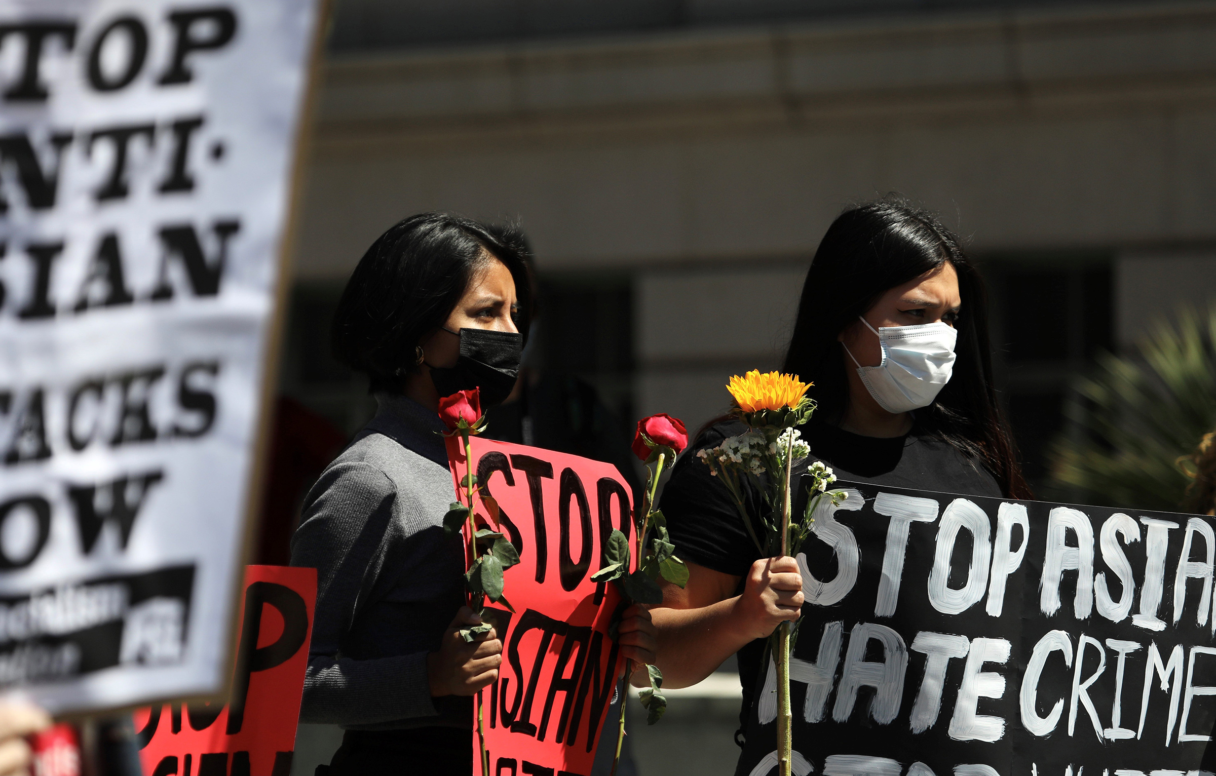 People participate in a Stop Asian Hate rally and march at City Hall in Los Angeles, on March 27, 2021.
