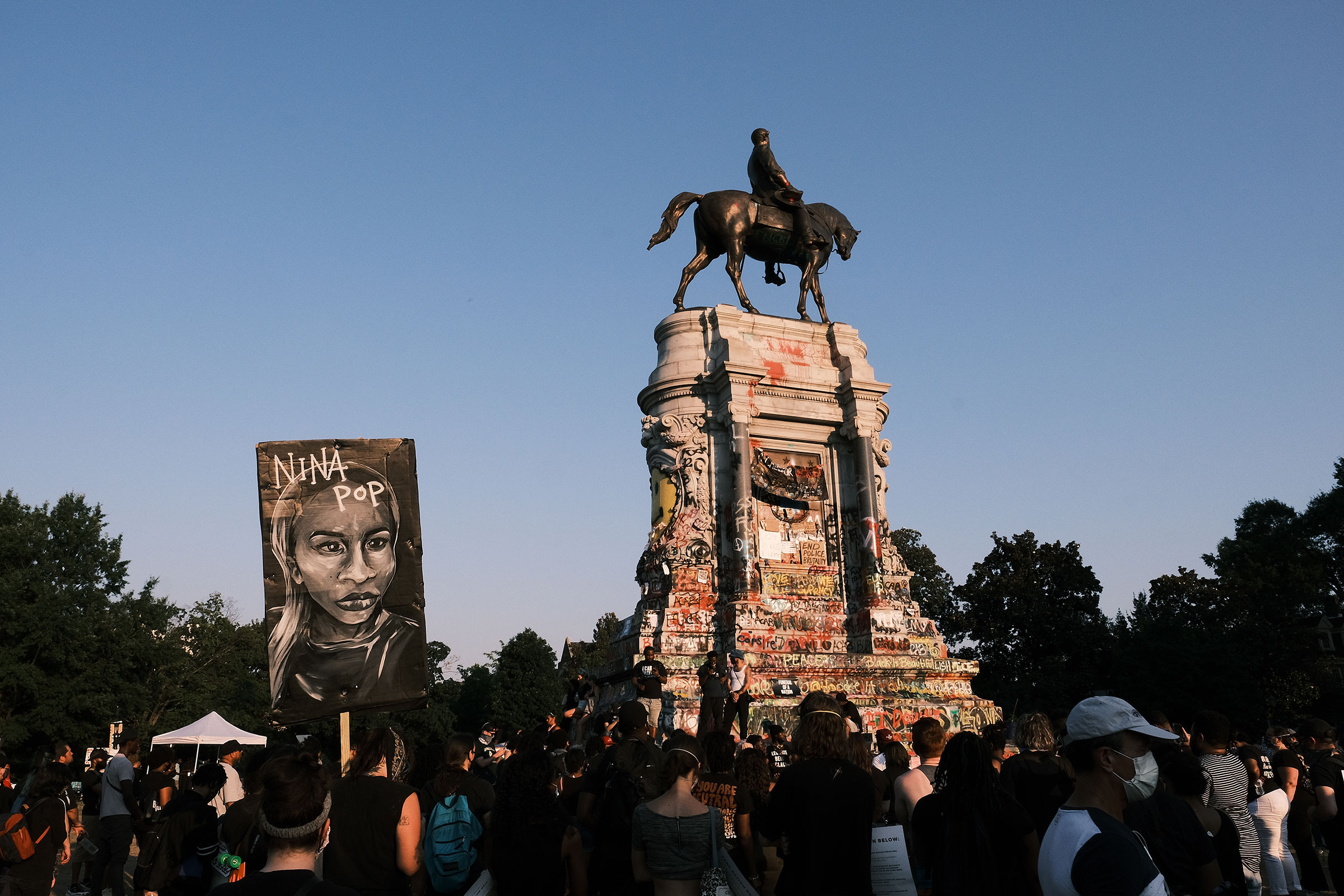 A banner showing the face of Nina Pop at the Lee statue during Black Women Matter "Say Her Name" march on July 3, 2020 in Richmond, Virginia.
