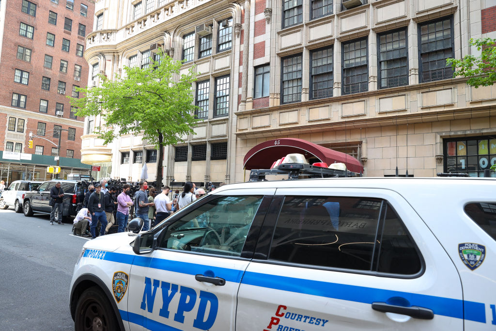 Media gather in front of Rudy Giuliani's Manhattan apartment after federal investigators executed a search warrant on April 28, 2021. (Tayfun Coskun—Anadolu Agency via Getty Images)