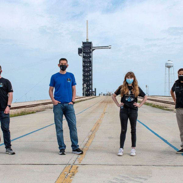 Chris Sembroski, Jared Isaacman, Hayley Arceneaux and Sian Proctor pose for a photo at NASA's Kennedy Space Center at Cape Canaveral, Florida, on March 29.