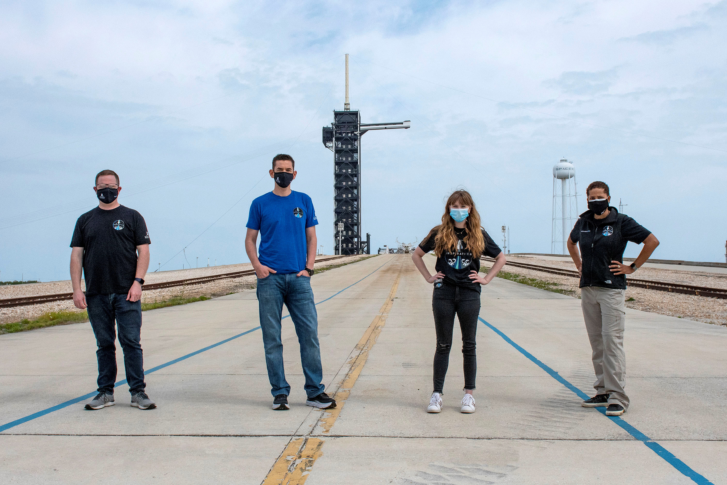 Jared Isaacman, Hayley Arceneaux, Sian Proctor and Chris Sembroski pose for a photo at NASA's Kennedy Space Center at Cape Canaveral, Florida, on March 29.