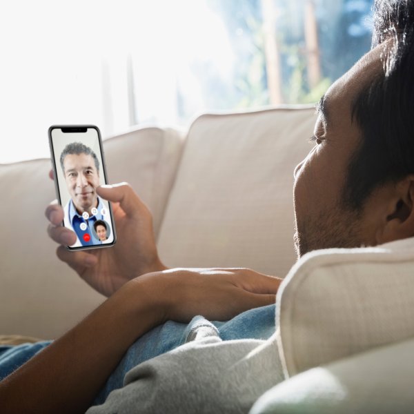 A patient visits with a doctor through the Teladoc app.