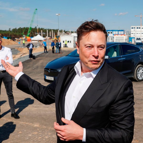 Tesla CEO Elon Musk talks to media as he arrives at a construction site in September, 2020.