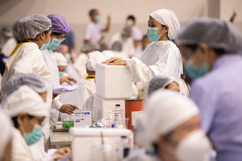 Health workers prepare to administer people with the CoronaVac vaccine developed by Sinovac firm inside a sport stadium in Phuket, Thailand on April 22, 2021. (Sirachai Arunrugstichai&mdash;Getty Images)