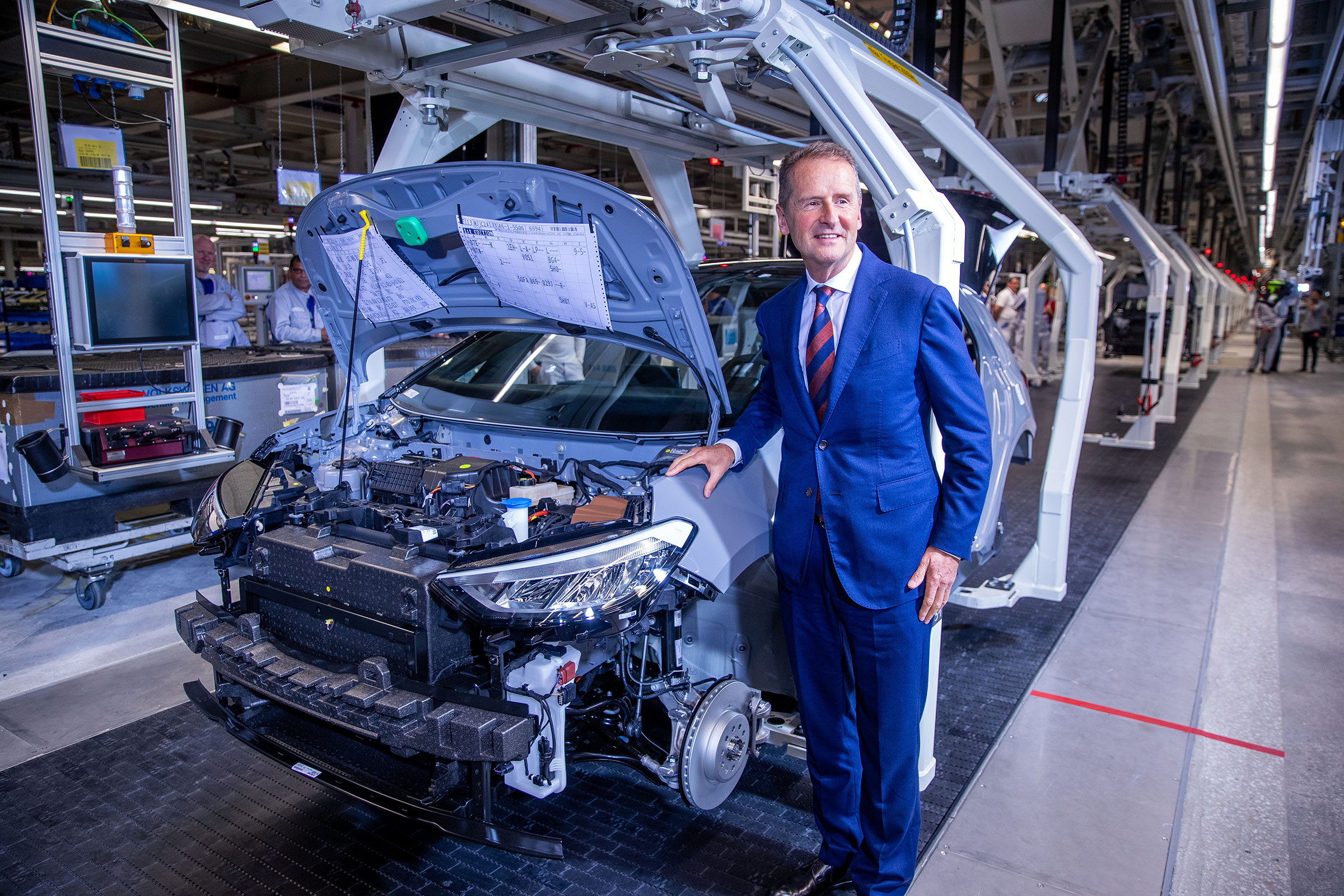 Herbert Diess, Volkswagen Group CEO, stands beside the assembly line for the production of the ID.3 electric car. (Jens Büttner—picture alliance/Getty Images)