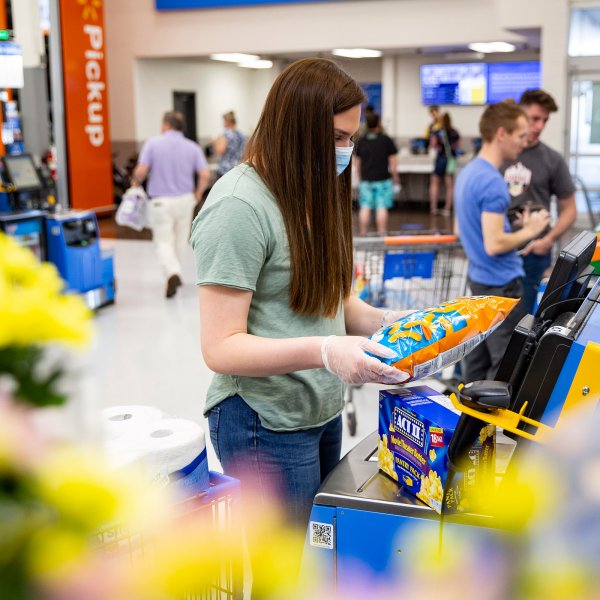 A customer uses self-checkout in a Walmart store in 2020.