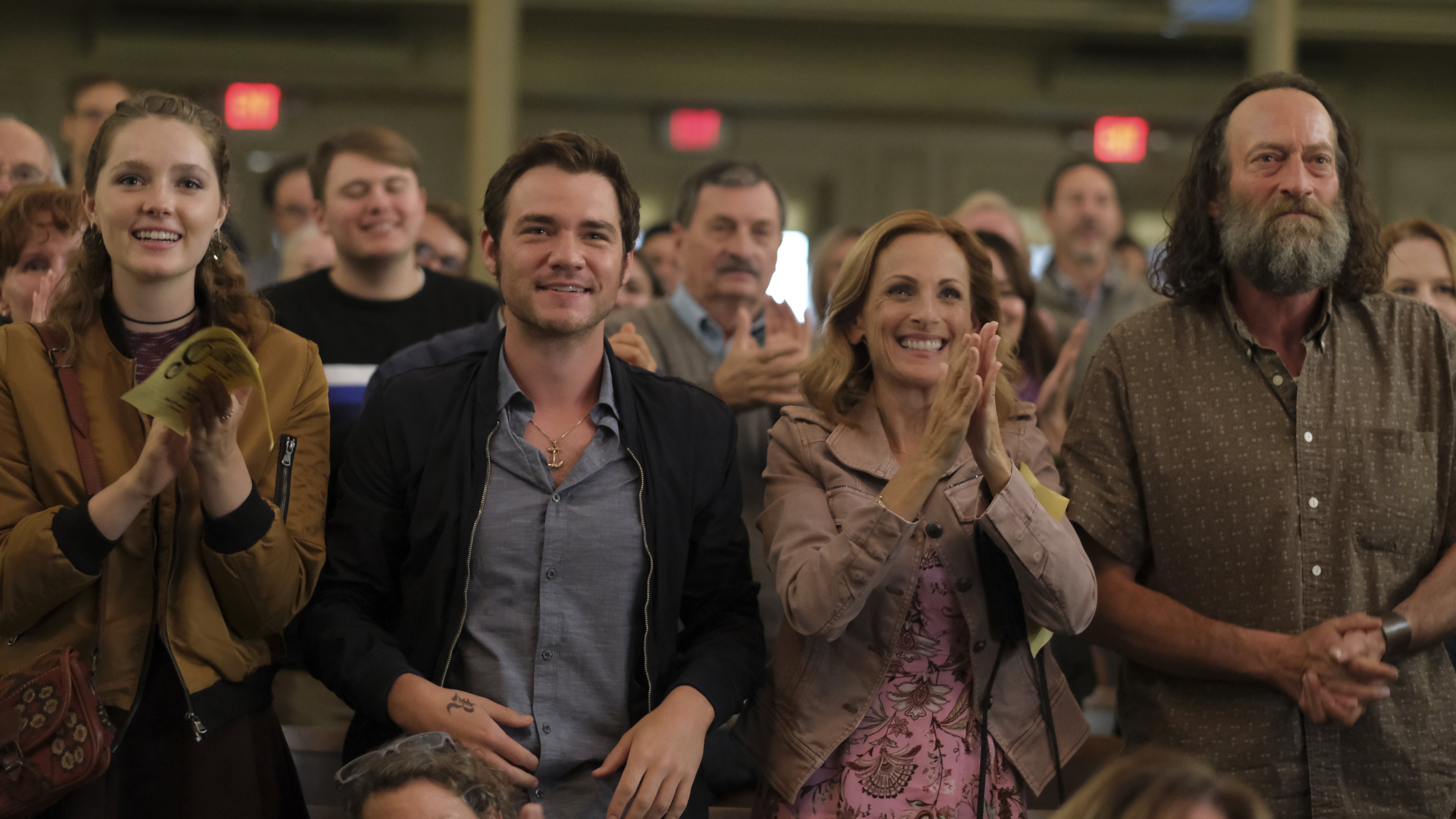 Marlee Matlin, second from right, plays the deaf mother of a hearing child in this family drama (Courtesy of Apple)