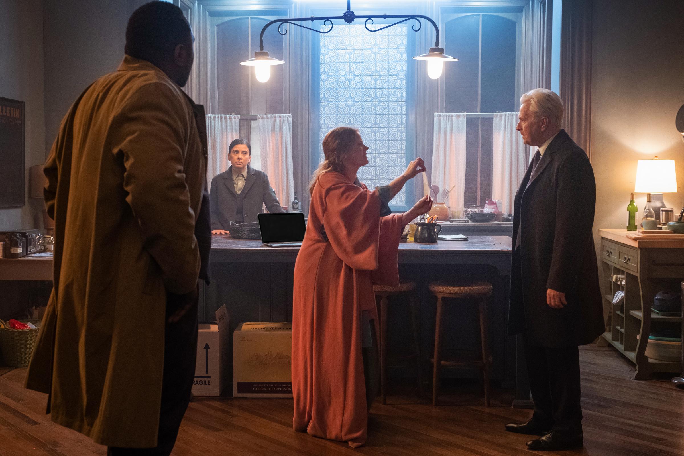 Woman in the Window (2021), L to R: Brian Tyree Henry as Detective Little, Jeanine Serralles as Detective Norelli, Amy Adams as Anna Fox, and Gary Oldman as Alistair Russell.