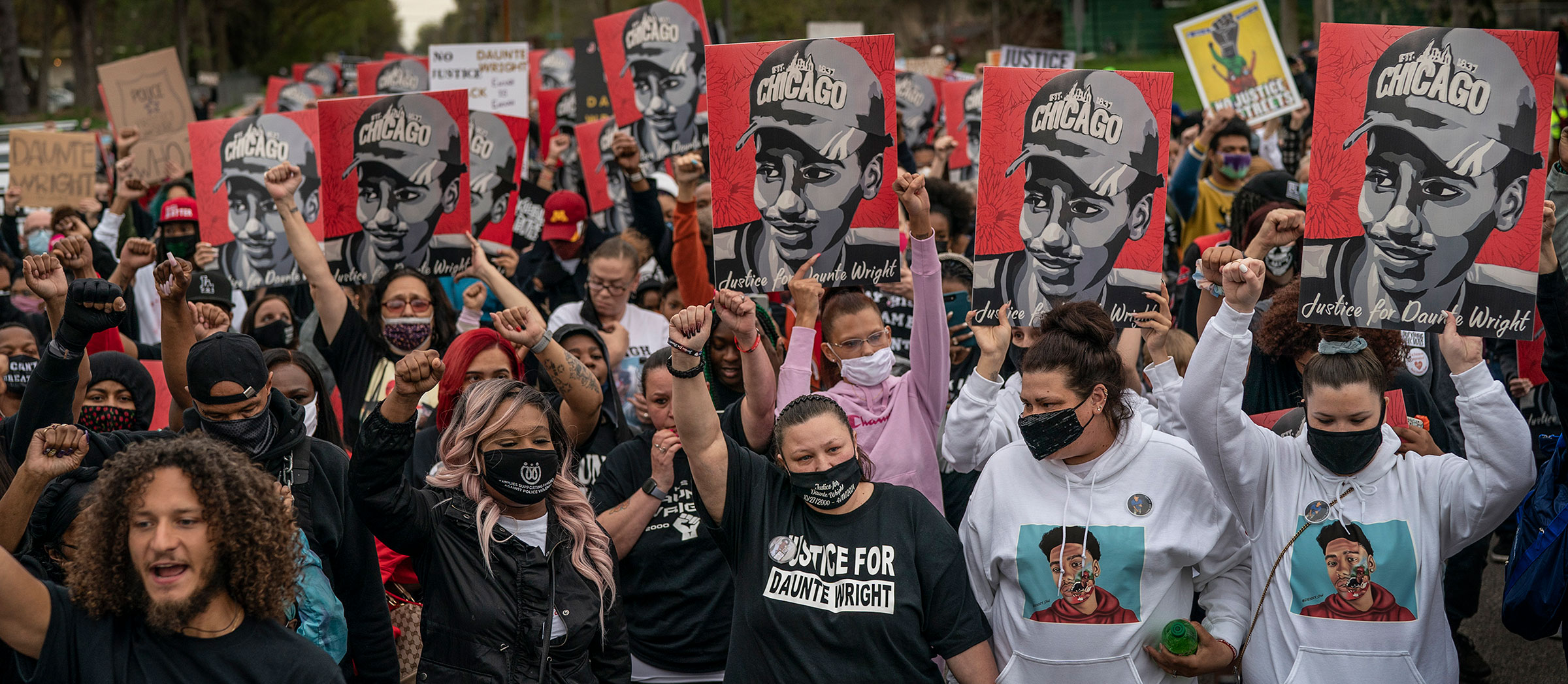 Katie Wright (center) surrounded by supporters marched to the Brooklyn Center Police department, demanding justice for her son Daunte Wright In Brooklyn Center, MN. (Jerry Holt—Star Tribune/Getty Images)