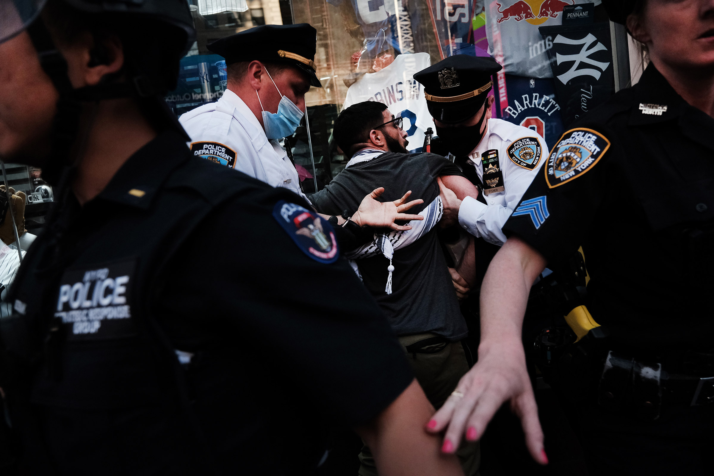 A pro-Palestinian protester is arrested during a violent clash with a group of Israel supporters and police in New York City's Times Square on May 20. (Spencer Platt—Getty Images)