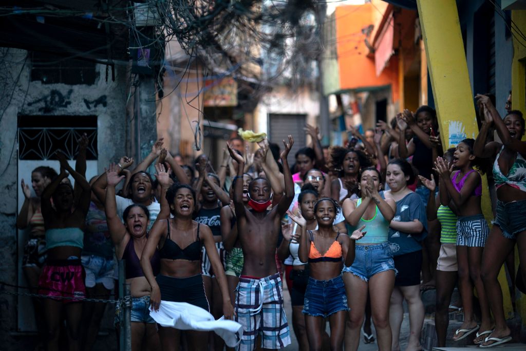 Residents protest after a police operation against alleged drug traffickers at the Jacarezinho favela in Rio de Janeiro, Brazil, on May 6, 2021. (Mauro Pimentel—AFP/Getty Images)