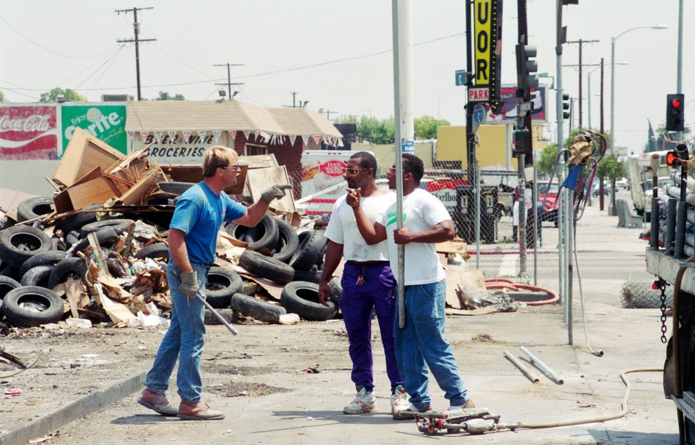 Armed with metal pipes, a construction worker (in blue) and demonstrators threaten one another during a protest on the northwest corner of the intersection of Florence and Normandie on Aug. 4, 1992. The demonstration was about the lack of Black employees on the job site.