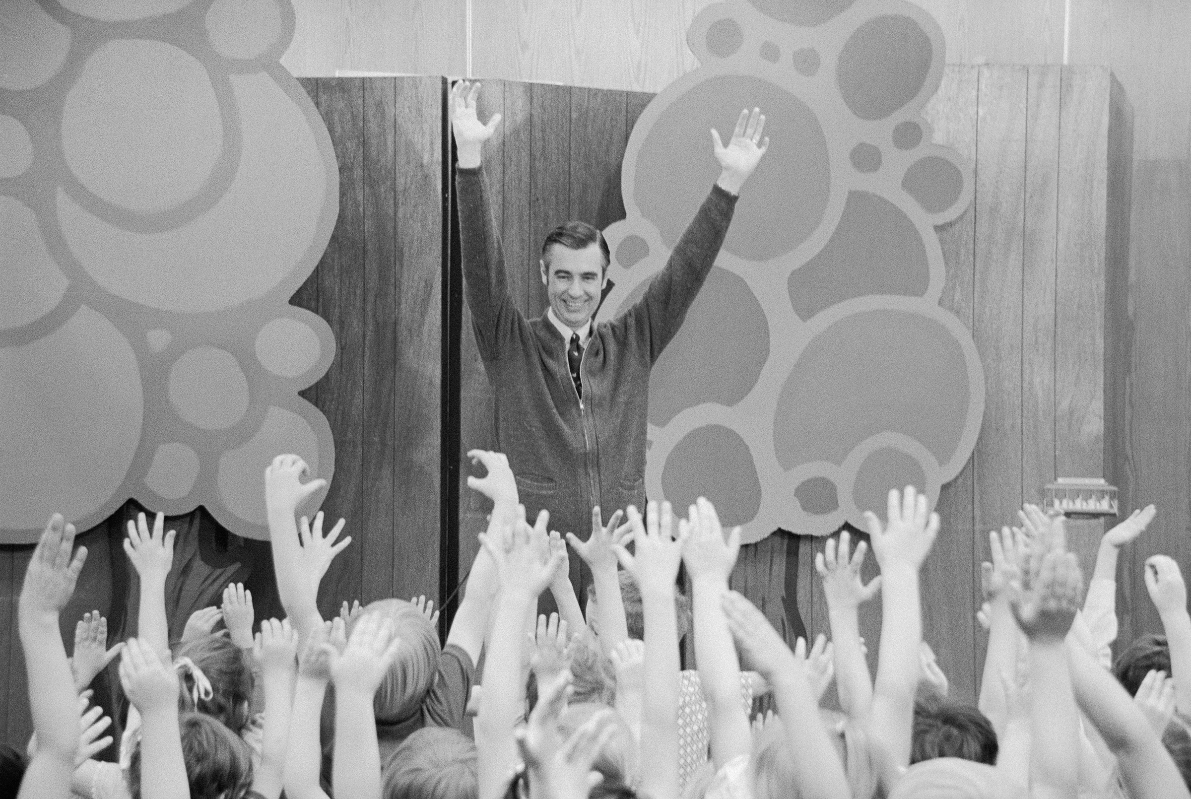 Fred Rogers of "Mister Rogers' Neighborhood" entertains children during a Mister Rogers' Day celebration. Several thousand children from the surrounding states attended the event held at the University of South Dakota on May 26, 1973