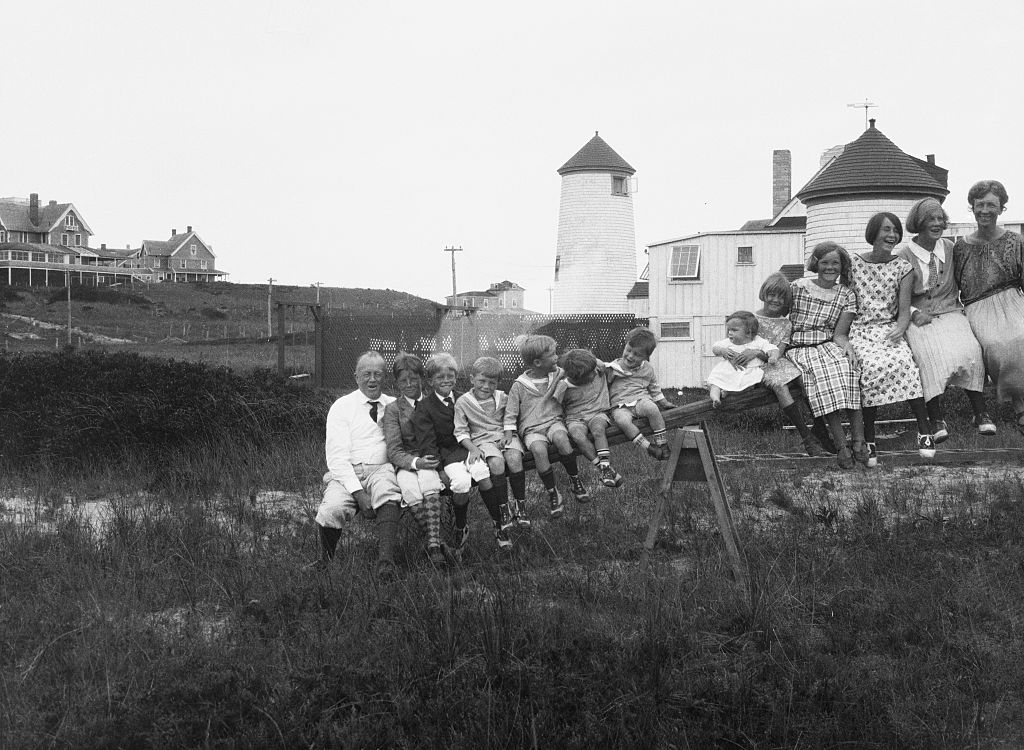 The Gilbreth family, including mother Lillian Gilbreth, a pioneering scientist, sits atop a see-saw in Nantucket, Mass., in 1923. (Bettmann Archive)
