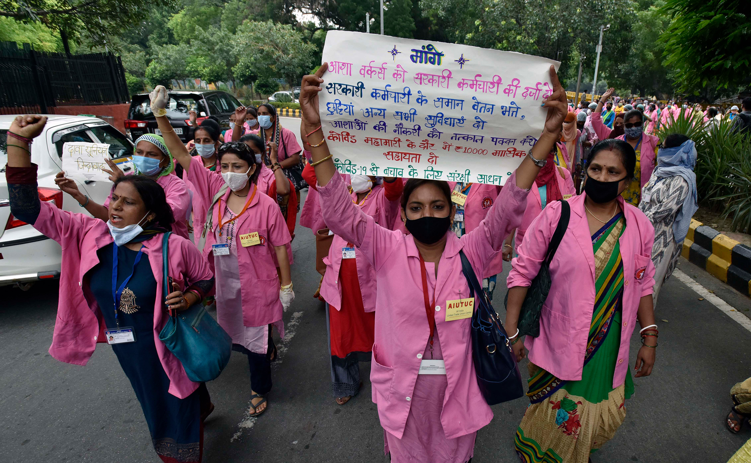 Accredited Social Health Activist (ASHA) workers protest against alleged negligence of their workforce by the government on August 9, 2020 in New Delhi. During the protest, ASHA workers demanded payment for their work during the COVID-19 pandemic, saying they have not been paid for the past few months. (Mohd Zakir—Hindustan Times/Getty Images)