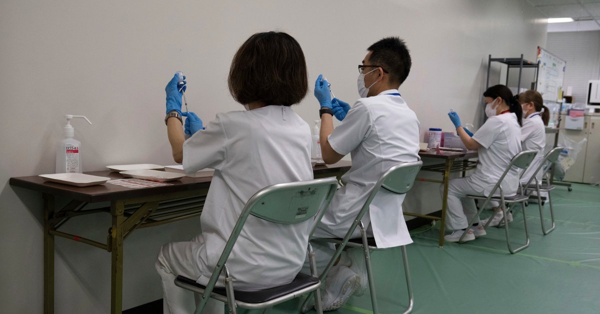Japan Opens Mass Vaccination Centers in Attempt to Curb COVID-19 Wave 2 Months Before Olympics