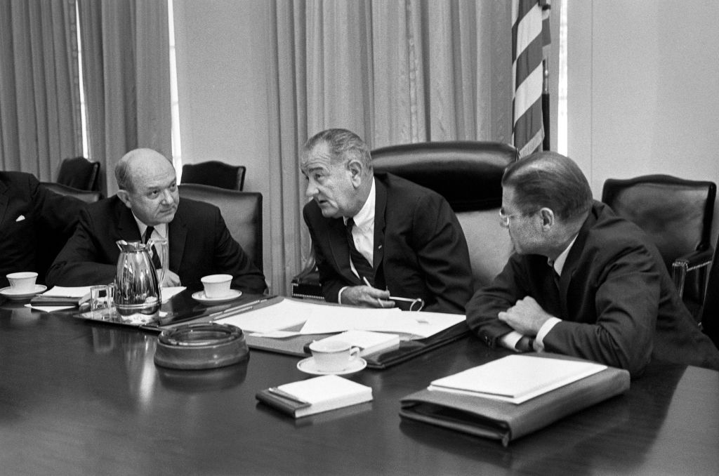 Secretary of Defense Robert McNamara (right), President Lyndon Johnson and Secretary of State Dean Rusk, seated at a table after McNamara's return from South Vietnam, in Washington, on July 21, 1965. (Warren K. Leffler—Universal History Archive/Universal Images Group/Getty Images)