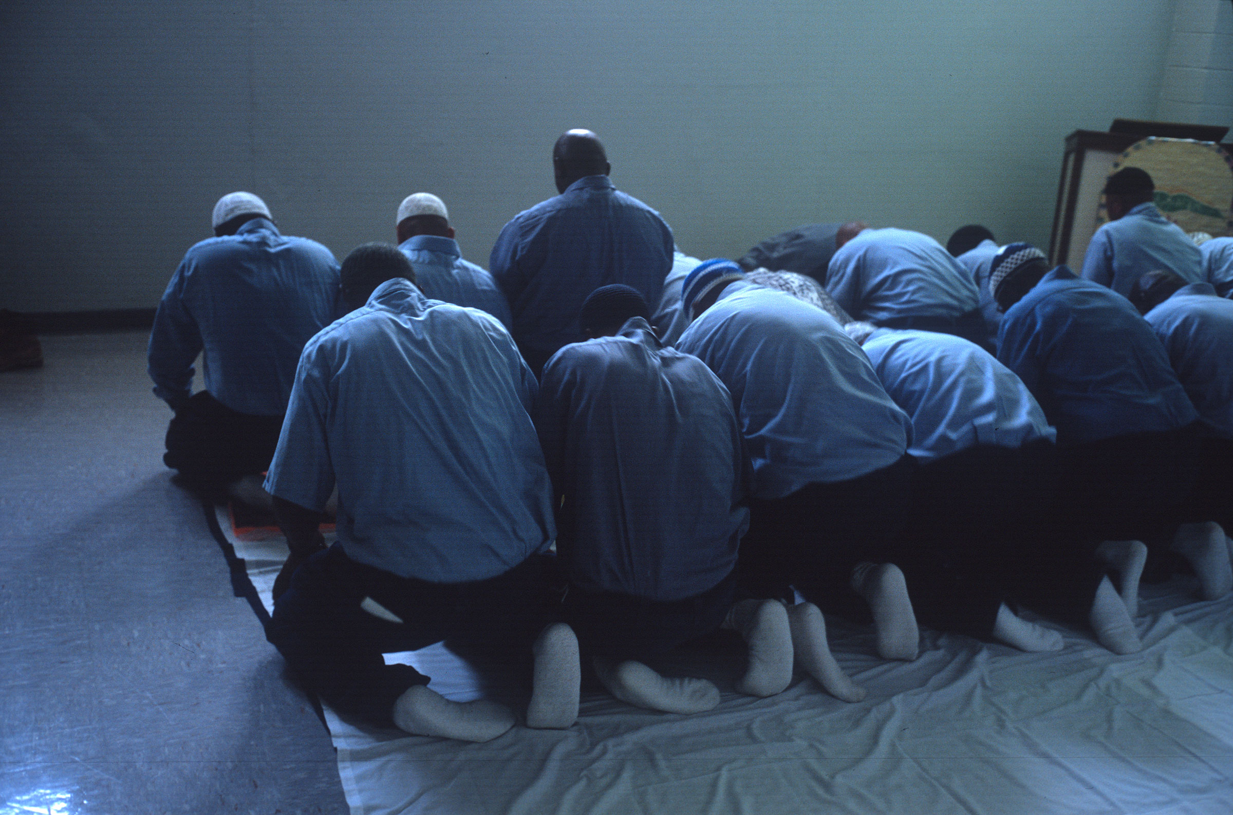 Muslim prisoners hold a Friday afternoon prayer in a Virginia state prison. (Andrew Lichtenstein—Corbis/Getty Images)