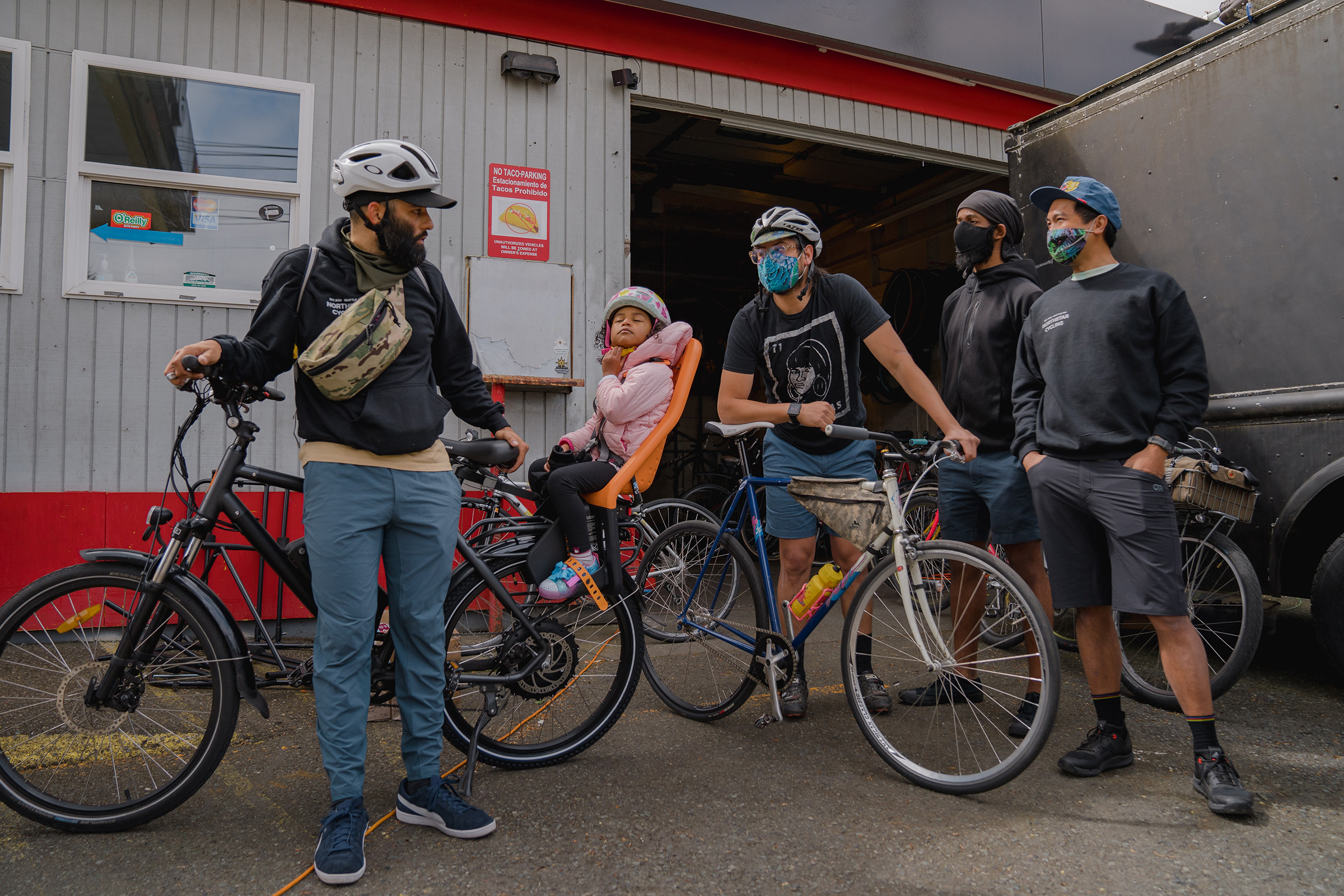 Edwin Lindo, left, co-founder of the NorthStar Cycling Club, discusses potential routes for the club’s weekly ride around Seattle.