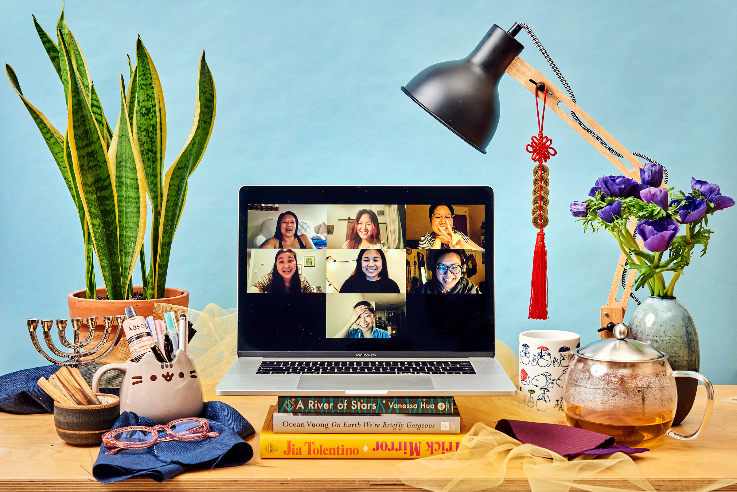 Clockwise from top left, Kari Lu Cowell, Amy Ding, Bianca Ng, Alex Wee, Maki Yamamoto, Jocelyn Krim and Victoria Kue attend their monthly virtual meeting on April 30. (Jessica Chou for TIME)