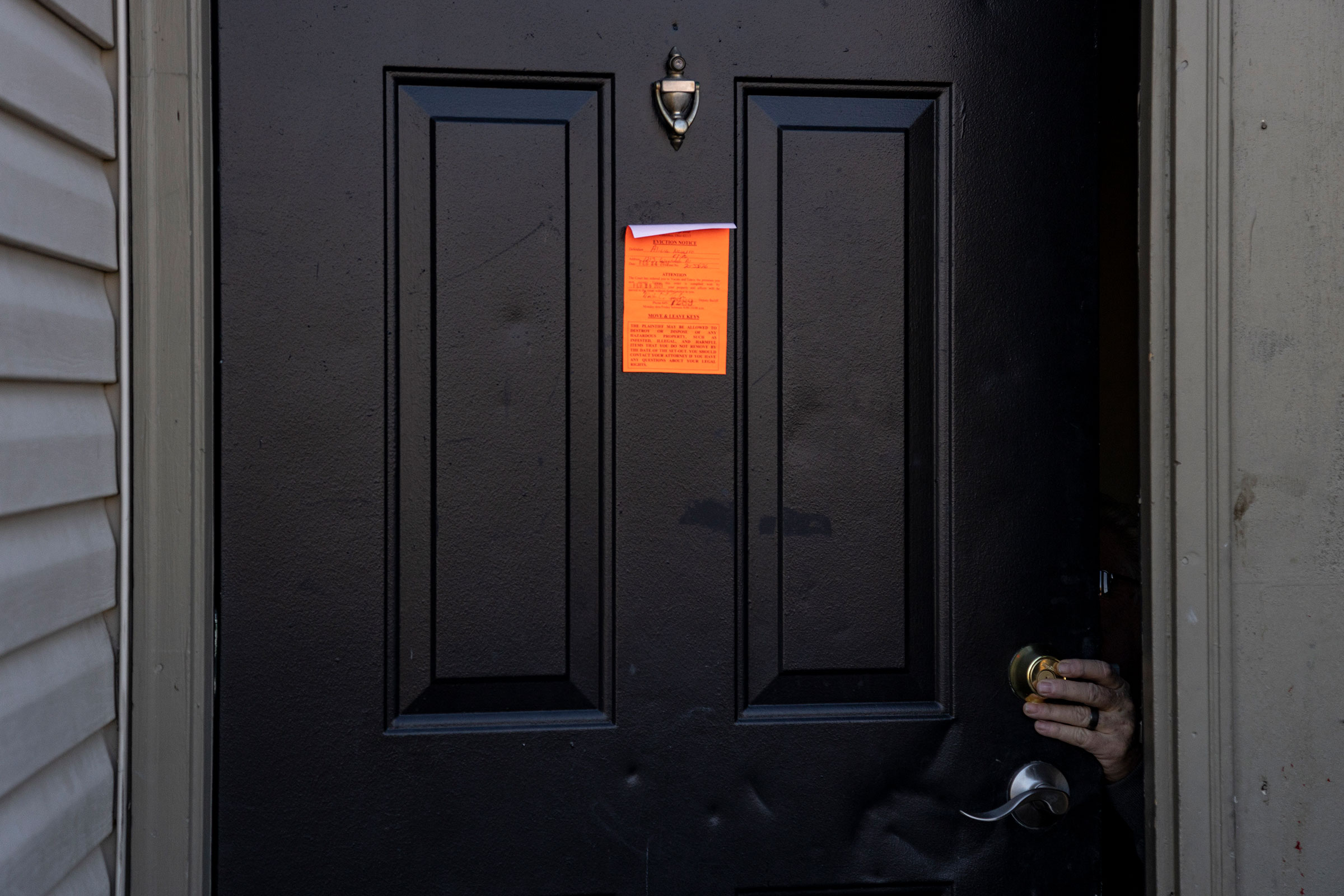 An eviction notice is posted and the lock is changed on a door in the unincorporated community of Galloway west of Columbus, Ohio on March 3, 2021. (Stephen Zenner—Getty Images)