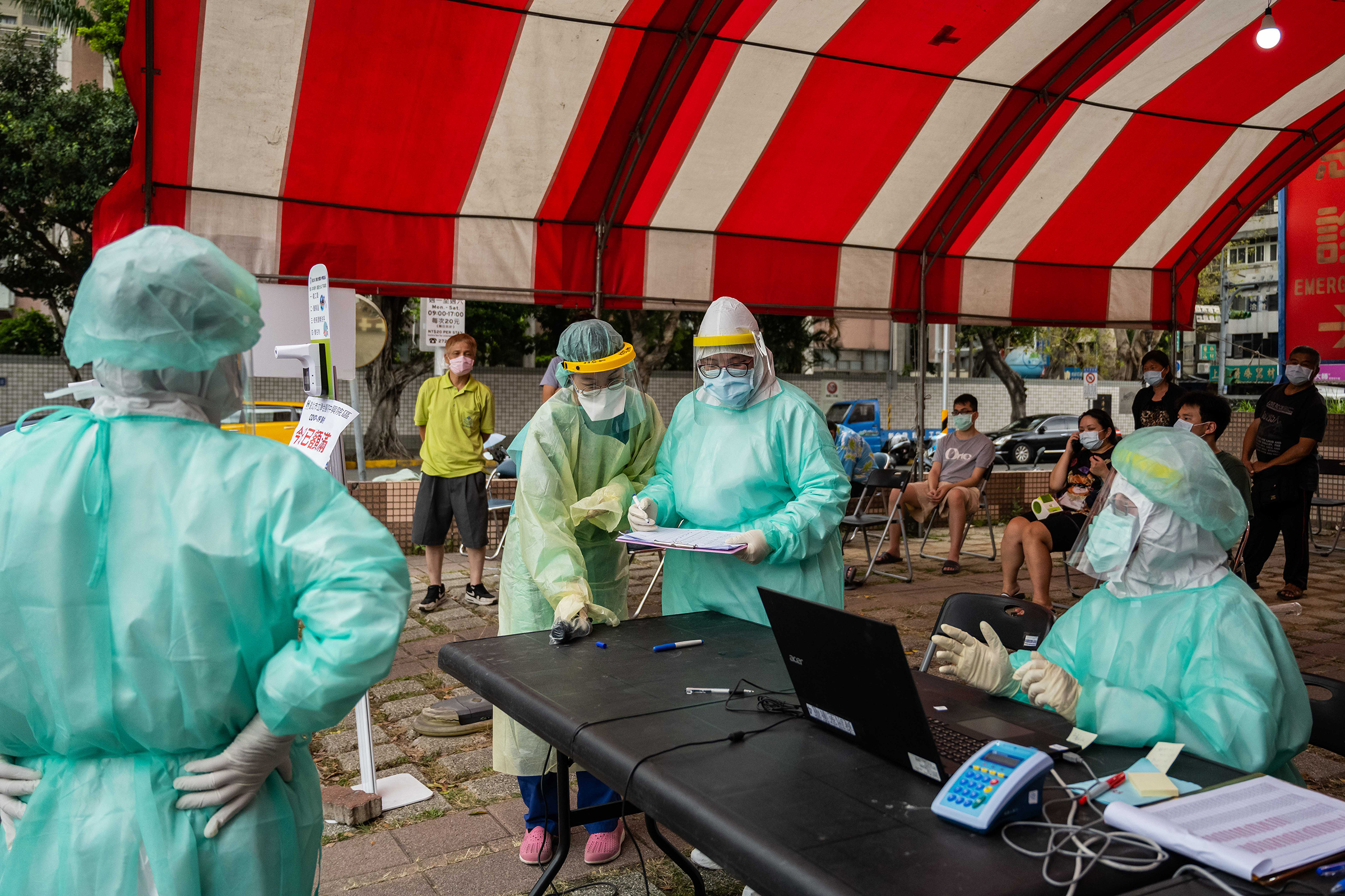 Health care workers at a temporary COVID-19 rapid testing site in Taipei on May 17, 2021. (Billy H.C. Kwok—Bloomberg/Getty Images)