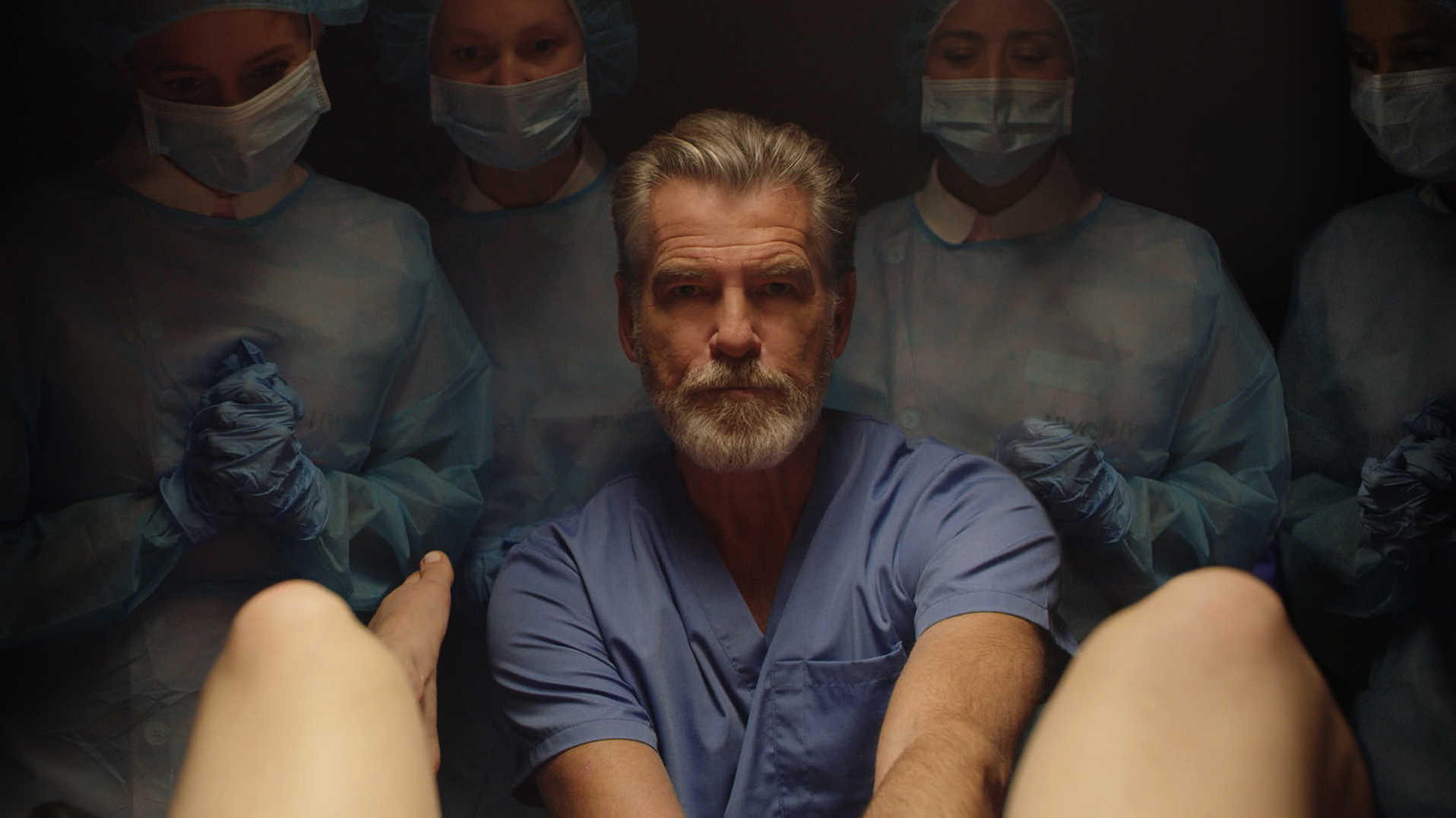 Pierce Brosnan plays a suave but vaguely unsettling fertility doctor in 'False Positive' (HULU—2021 Hulu)