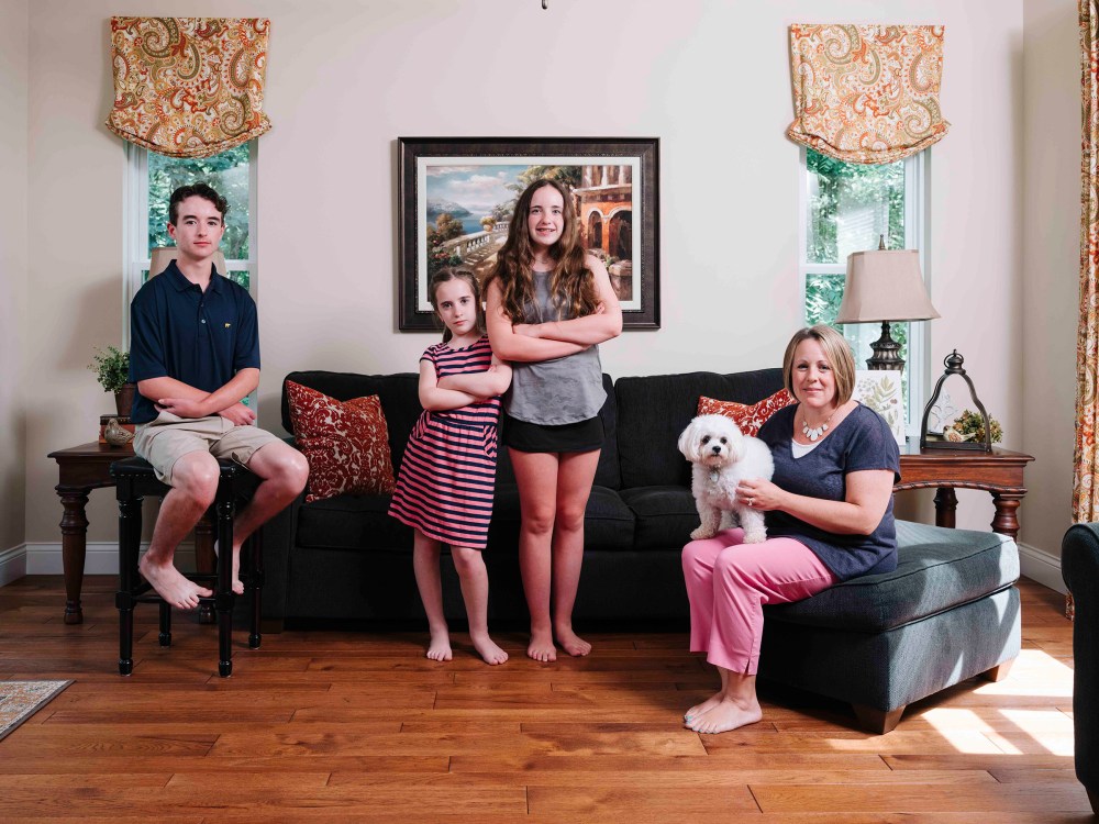 Shauna Poggio at home with her three kids, (left) Cole, Corinne and Raegan.