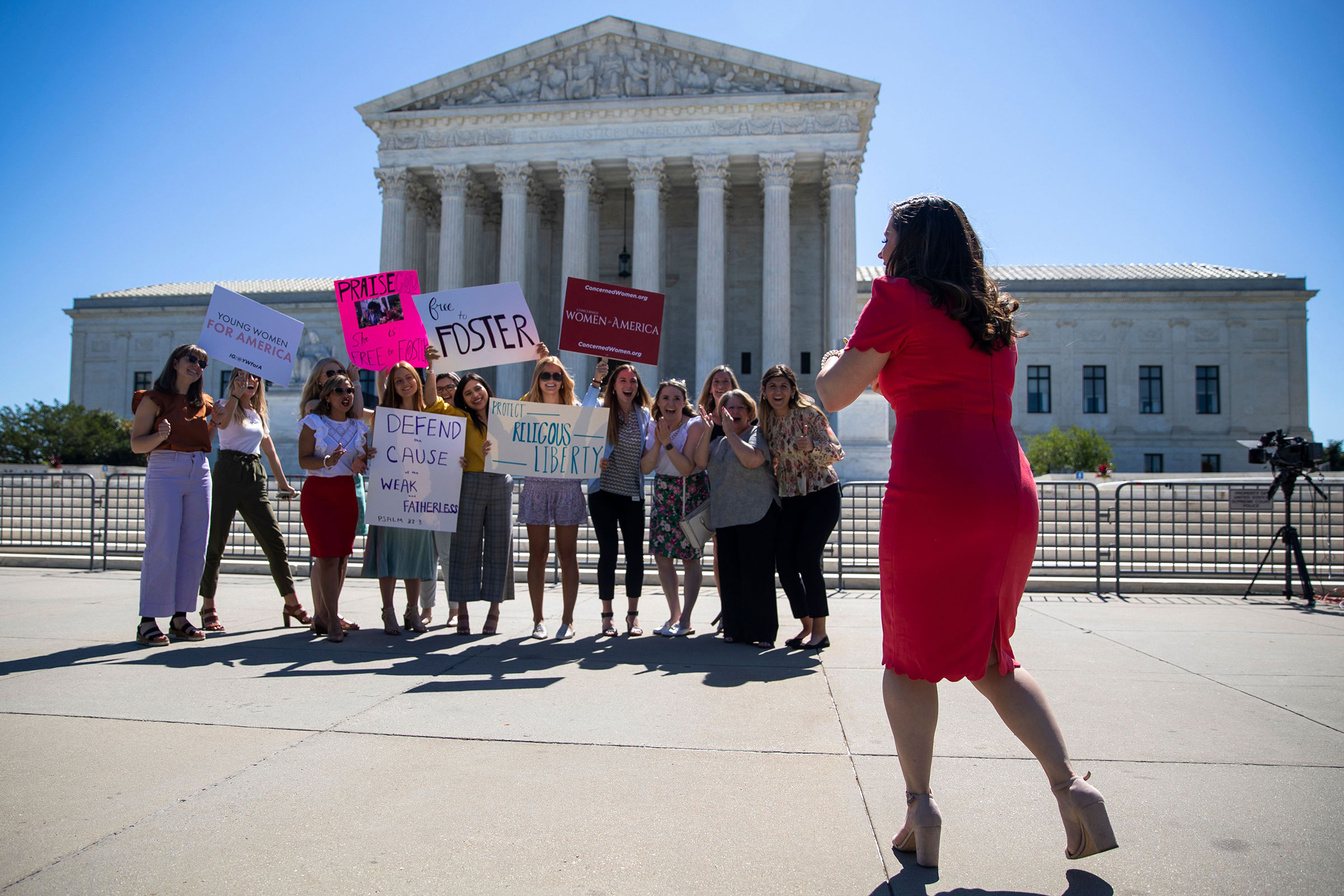 People stand in front of the Supreme Court in Washington, DC on June 17, 2021. (Shawn Thew — EPA / Shutterstock)