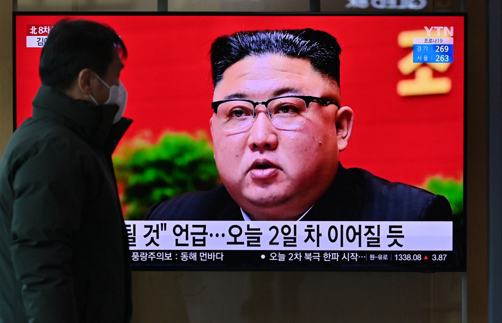 A man watches a television screen showing news footage of North Korean leader Kim Jong Un attending the 8th congress of the ruling Workers' Party held in Pyongyang, at a railway station in Seoul on January 6, 2021. (JUNG YEON-JE/AFP via Getty Images)