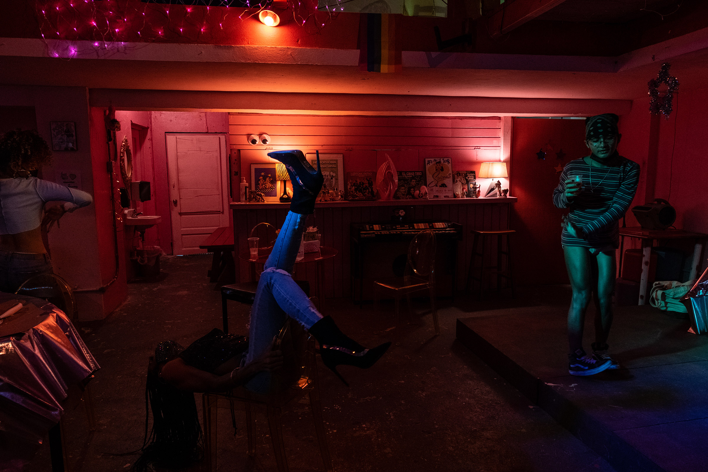 Left to right: Coco, Teresa, and Beibijavi dance during the House of Grace holiday dinner at Loverbar in Rio Piedras, San Juan, Puerto Rico. (Gabriella N. Báez—Magnum Foundation)