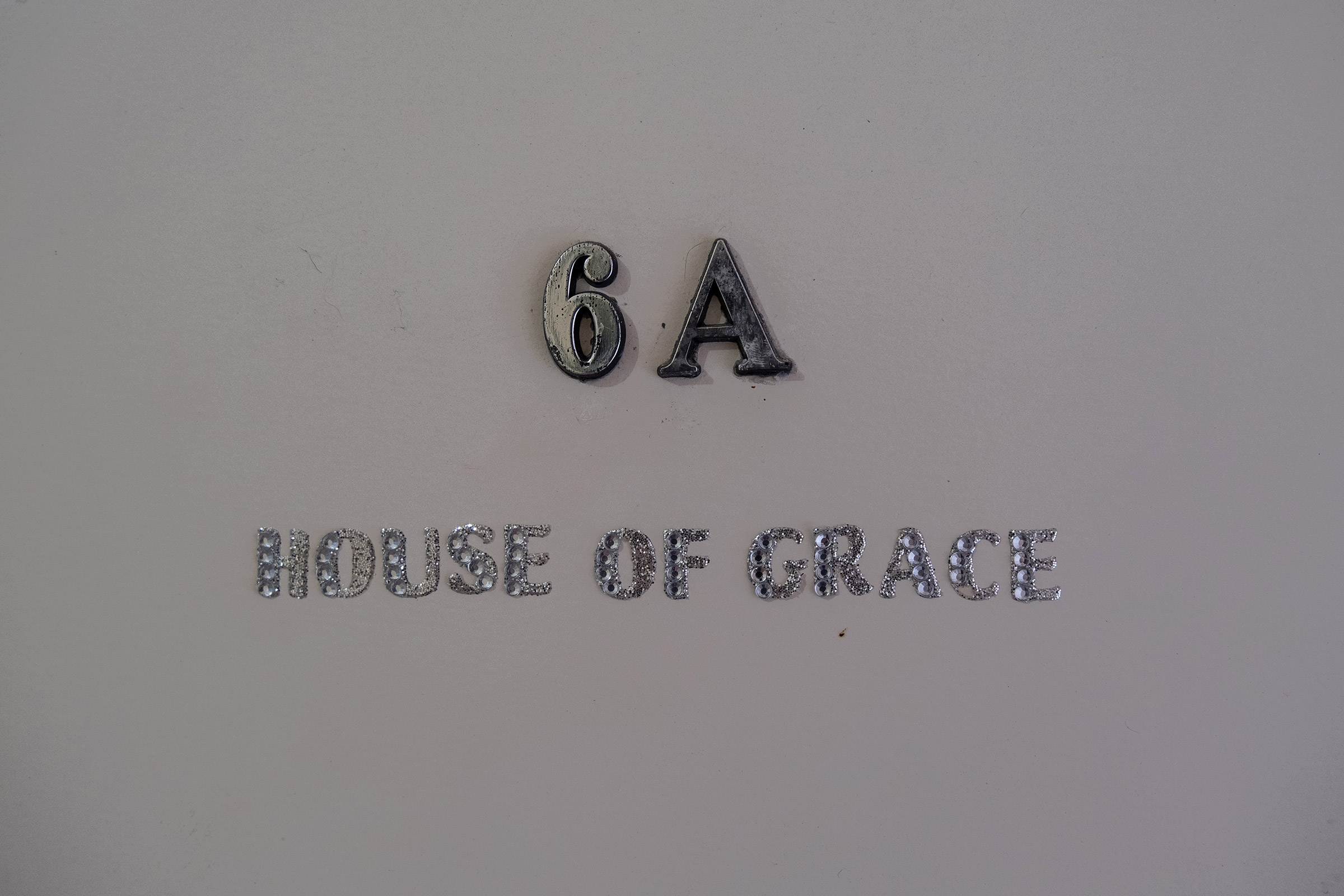 María José’s apartment door reads “House of Grace” in Rio Piedras, San Juan, Puerto Rico. (Gabriella N. Báez—Magnum Foundation)