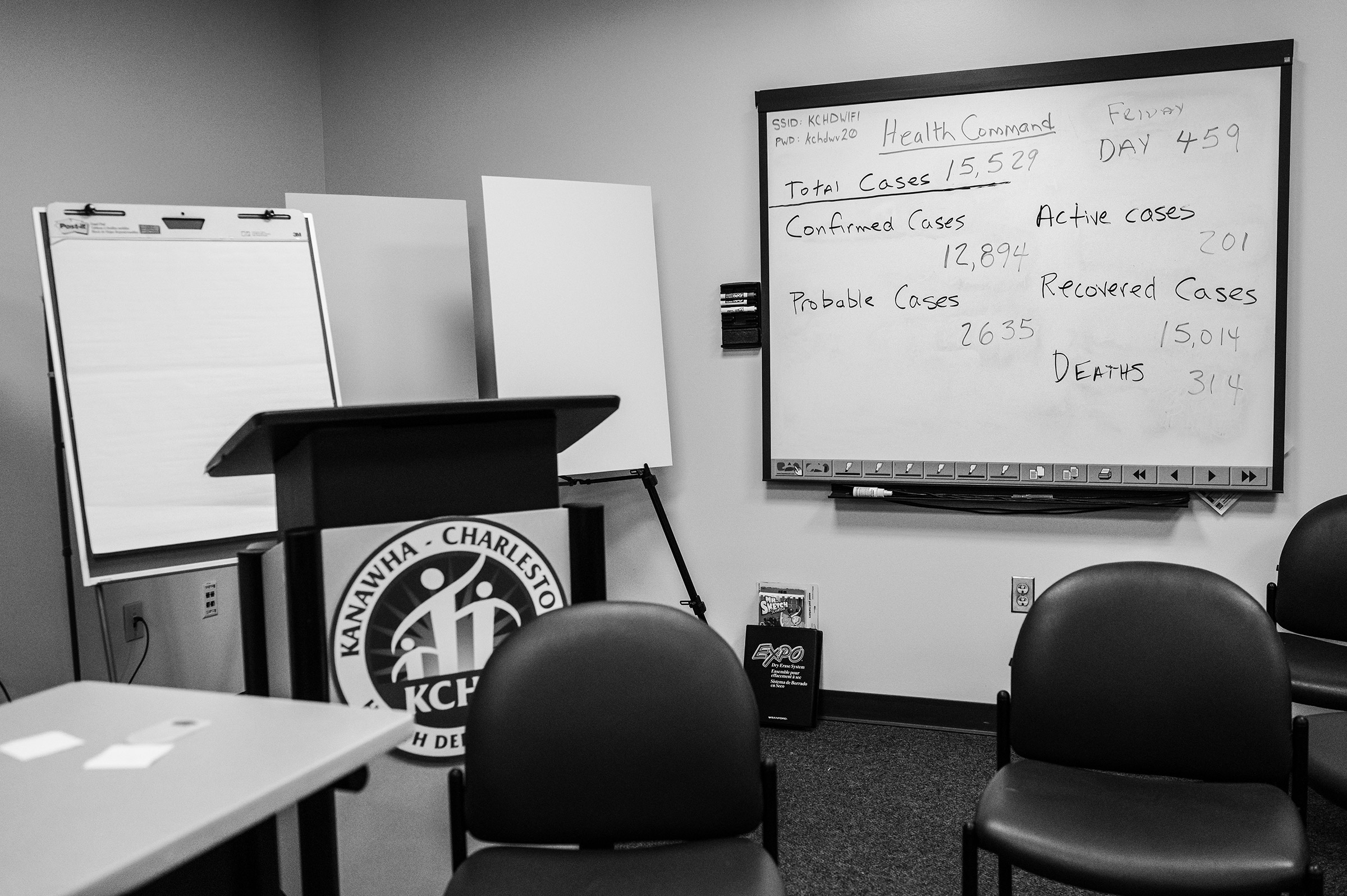 A dry erase board with the county's Covid-19 statistics hangs in the Kanawha-Charleston Health Department in Charleston on June 4, 2021. (Rebecca Kiger for TIME)